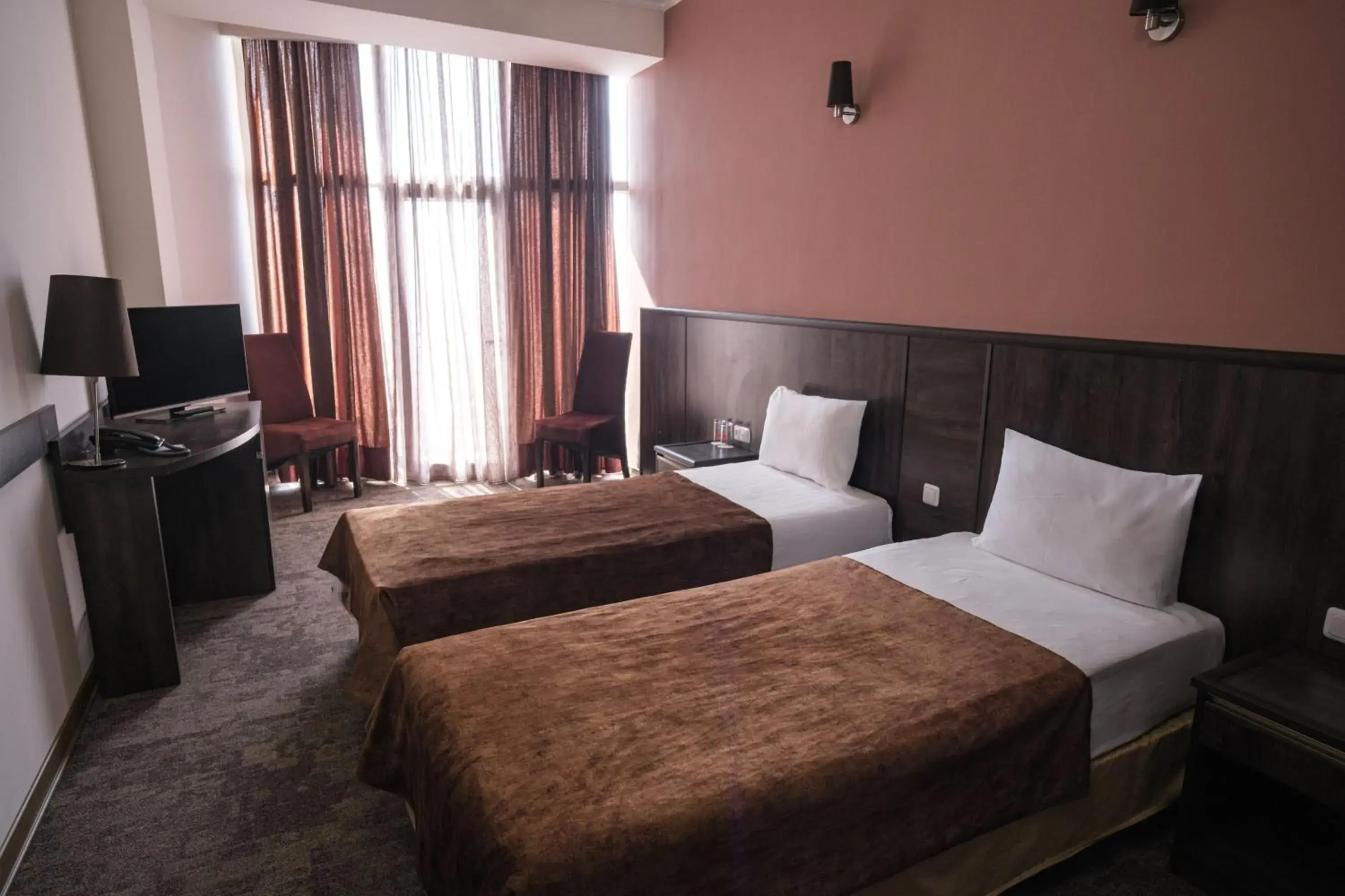 Photo of the whole room, Bed in Regineh Hotel