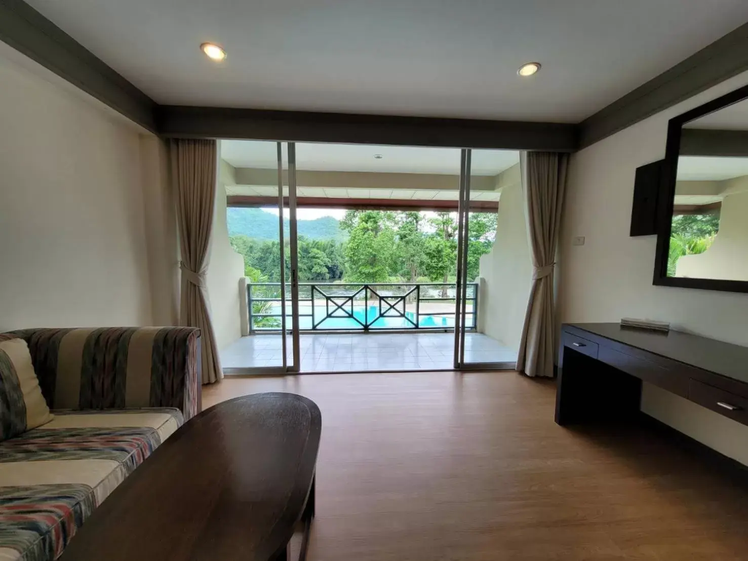 Living room, Pool View in Aekpailin River Kwai Resort