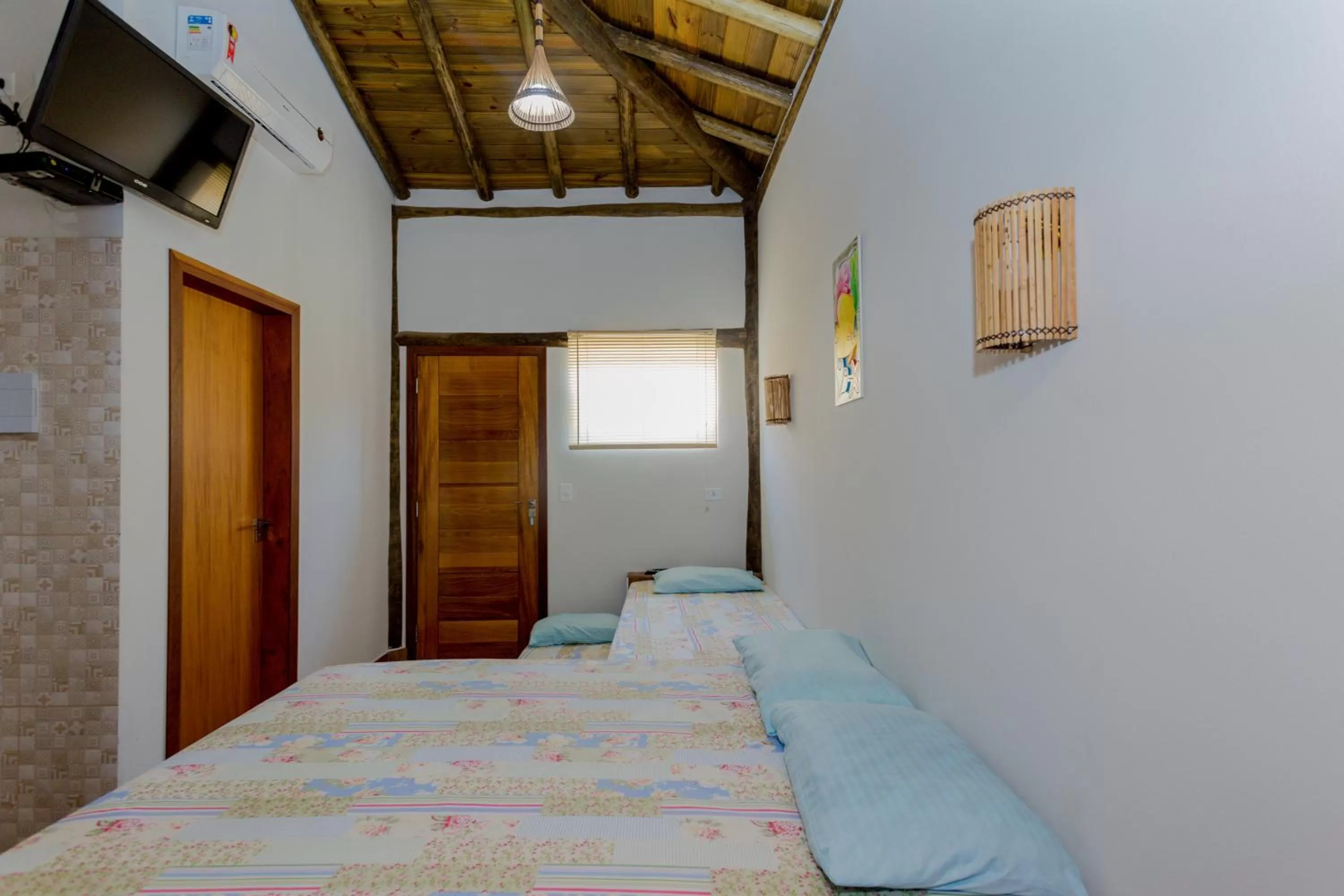 Bed in Pousada Chalés do Julião