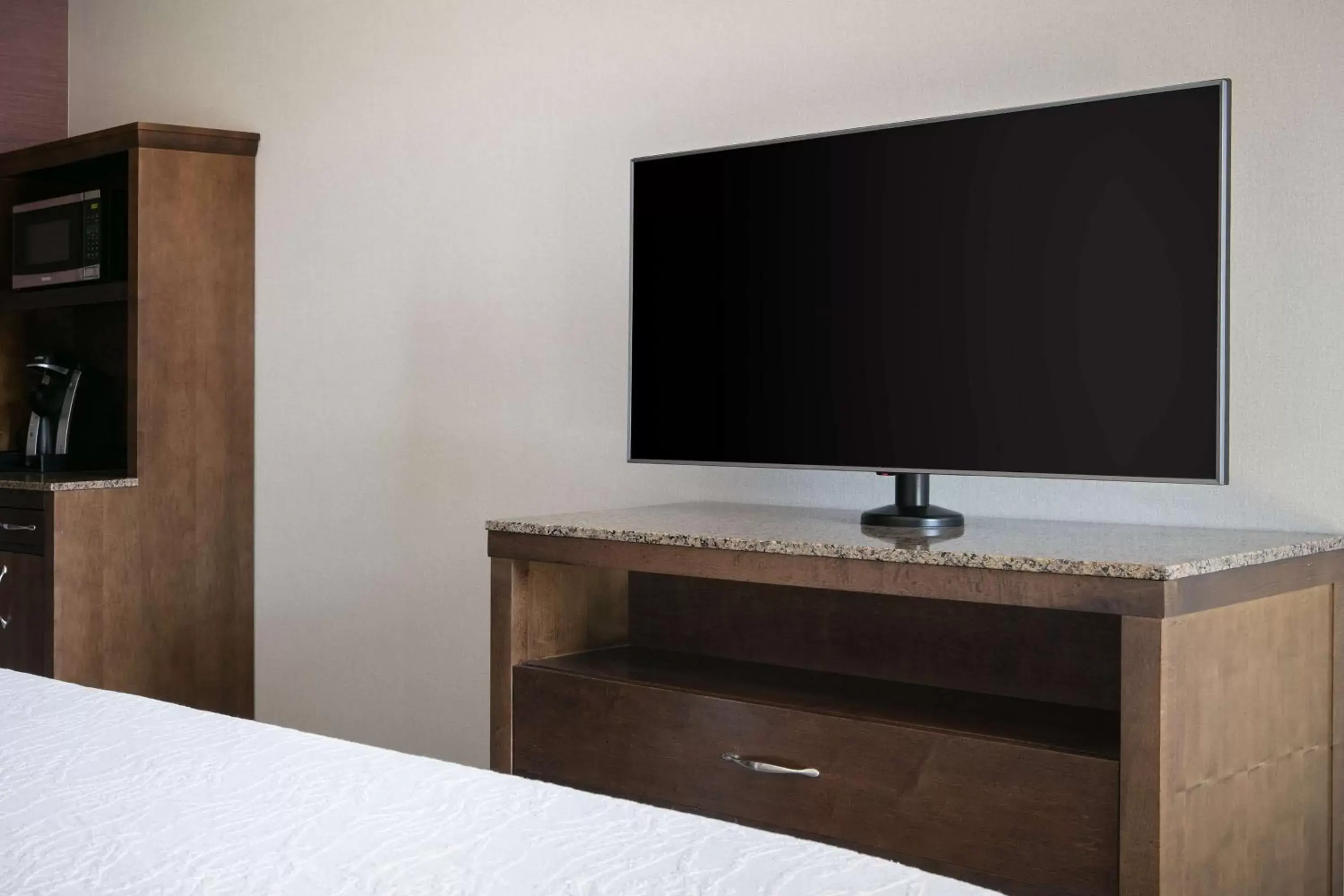 Bed, TV/Entertainment Center in Hilton Garden Inn Manhattan Kansas