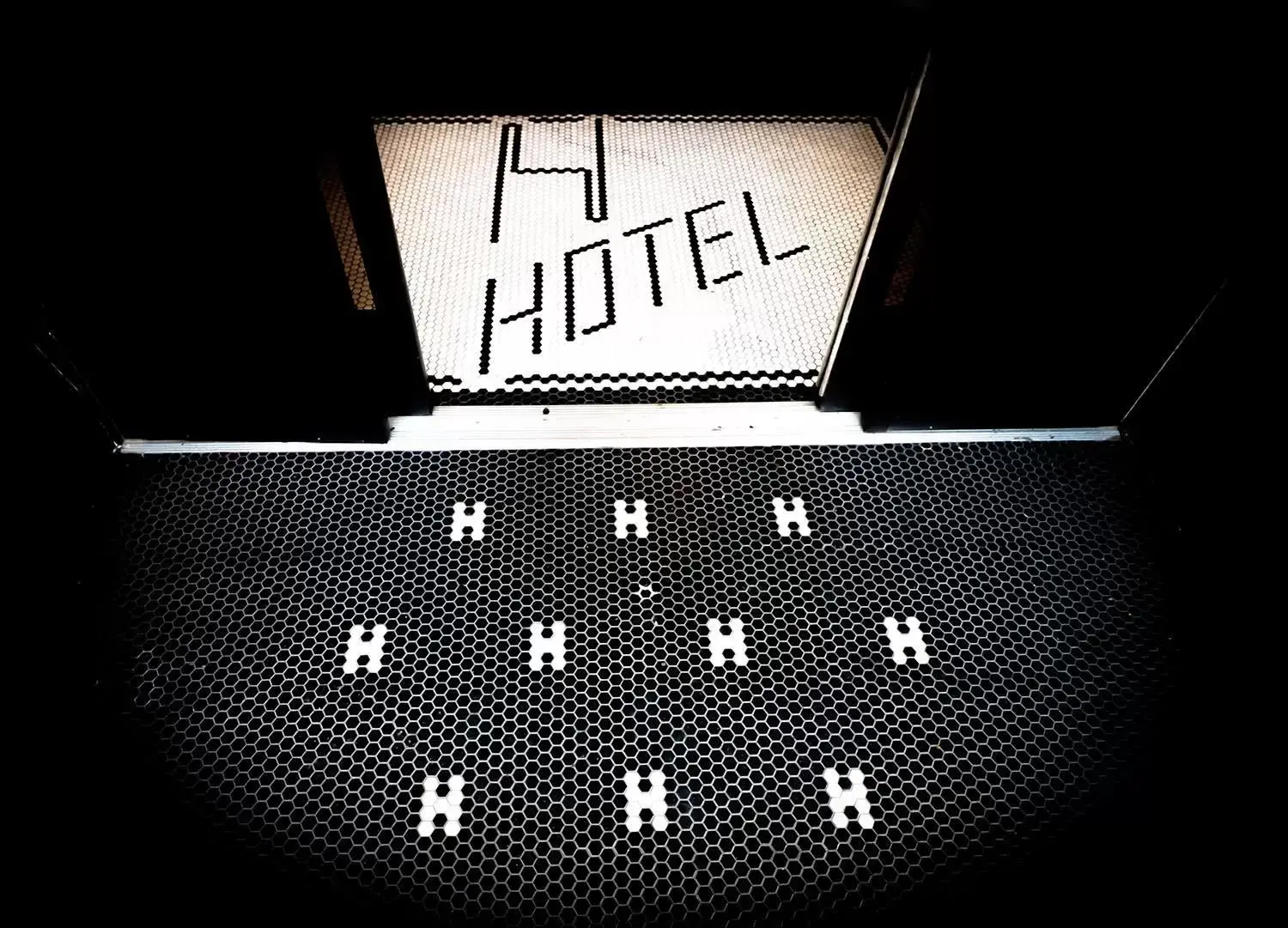 Property logo or sign in H by H Hospitality