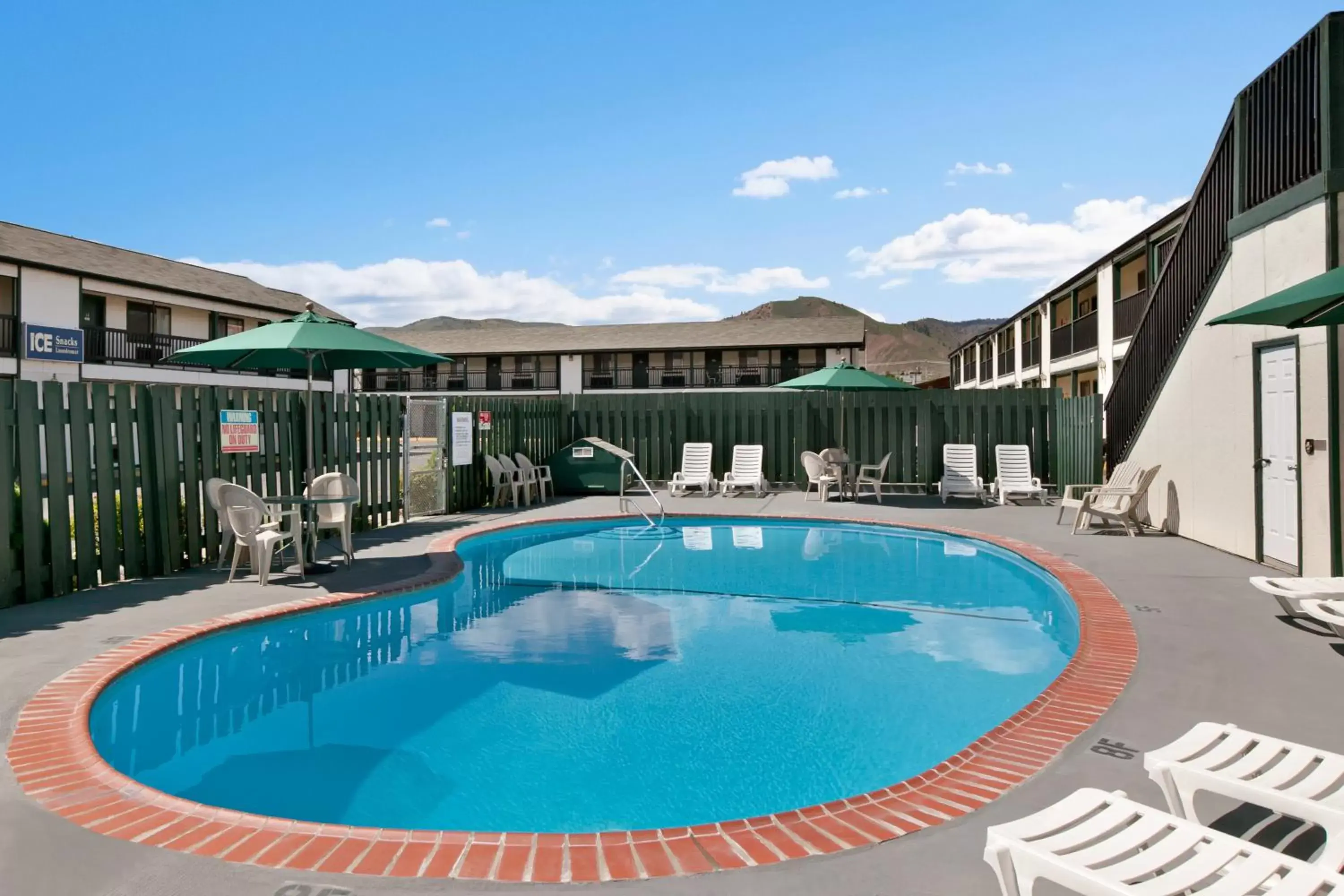 Swimming pool, Property Building in Travelodge by Wyndham Wenatchee