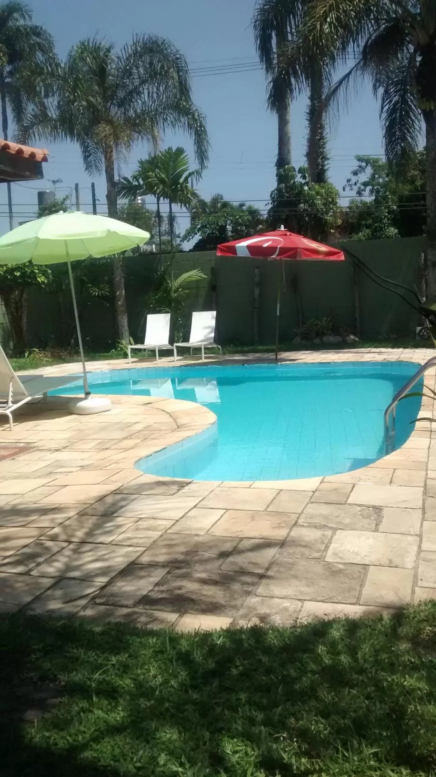 Swimming pool in Pousada Na Praia Ubatuba