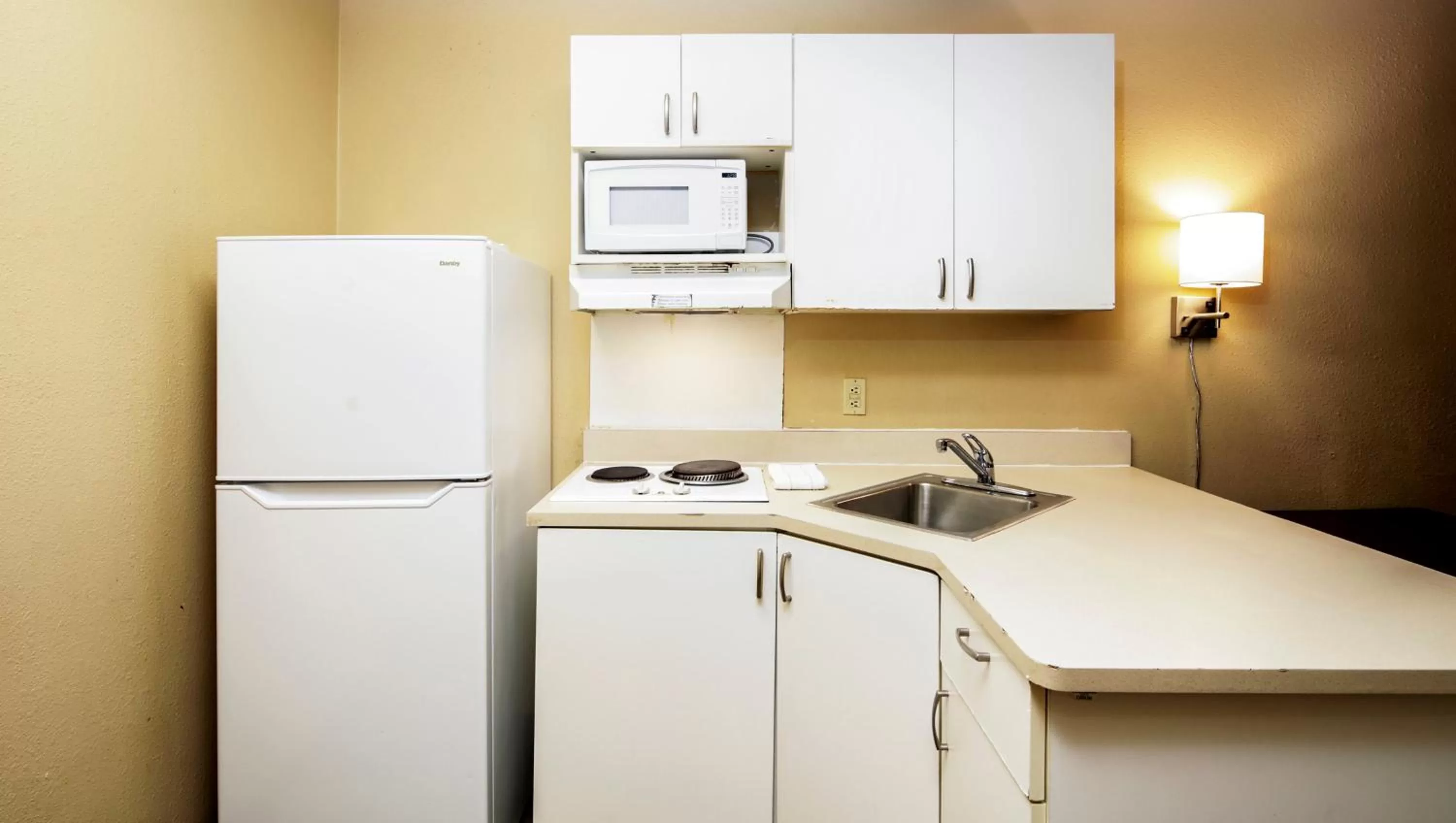 Kitchen or kitchenette in Home 1 Suites Extended Stay