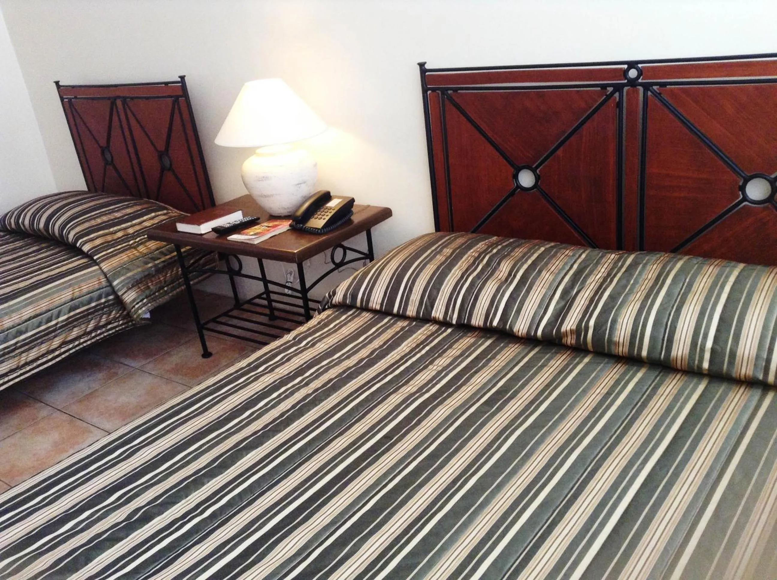 Bed in Citystate Asturias Hotel Palawan