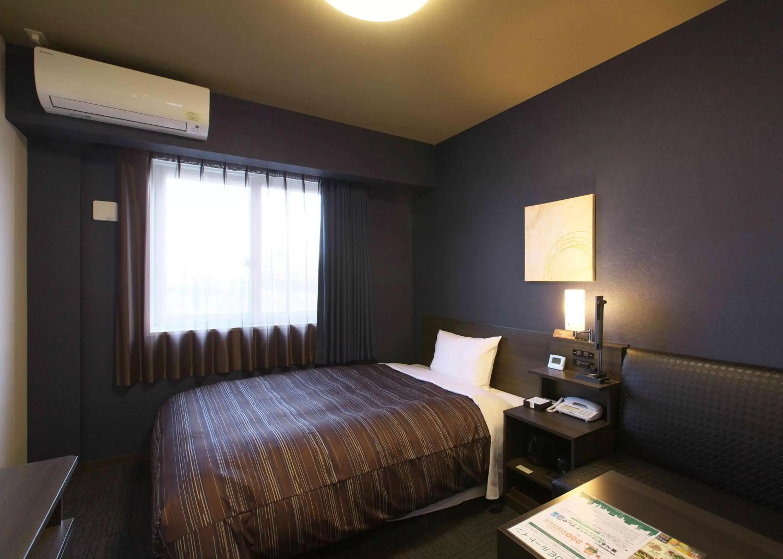 Bed in Hotel Route Inn Osaka Izumi -Kishiwada Izumi Inter-