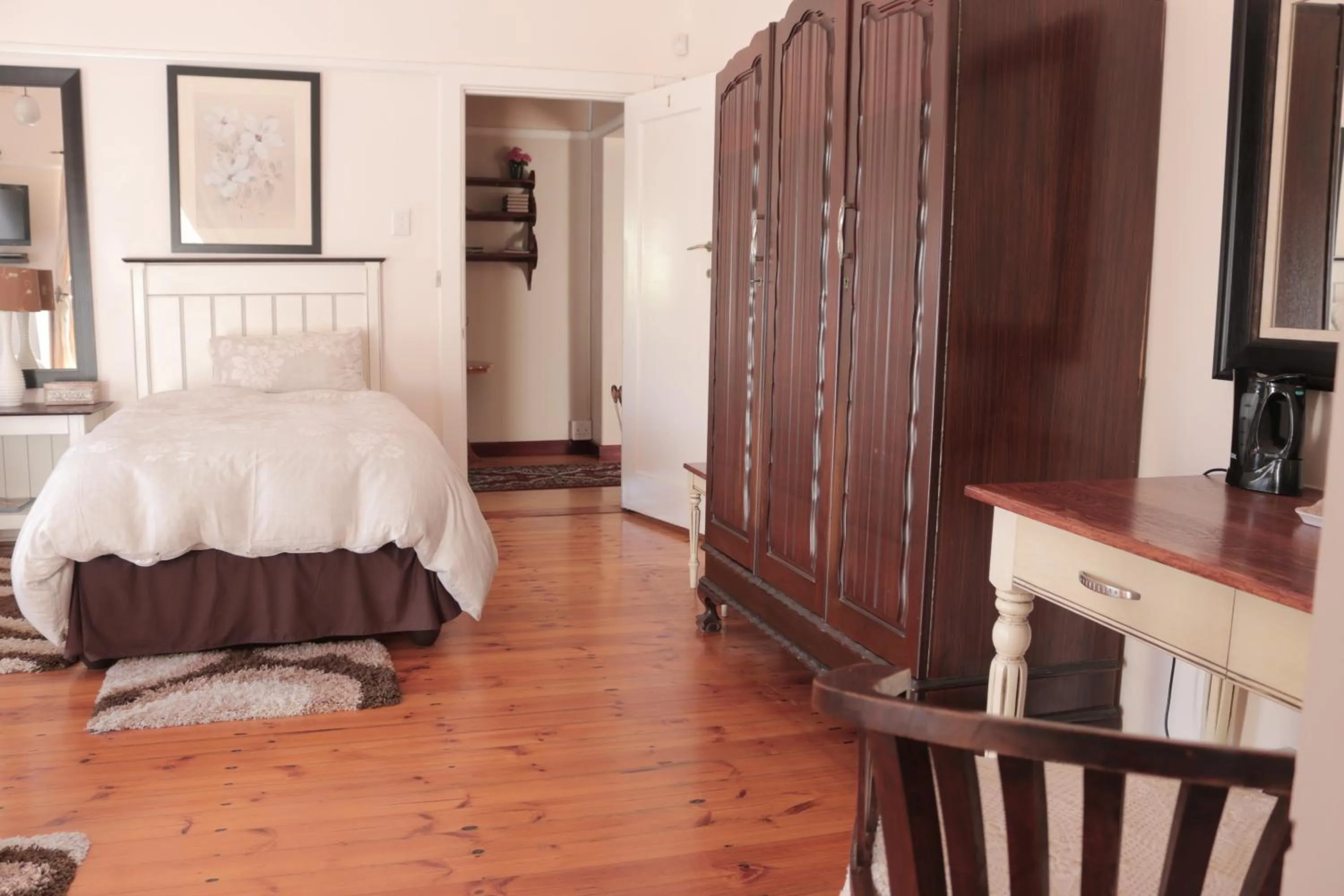 Bed in Rose Petals Guest House