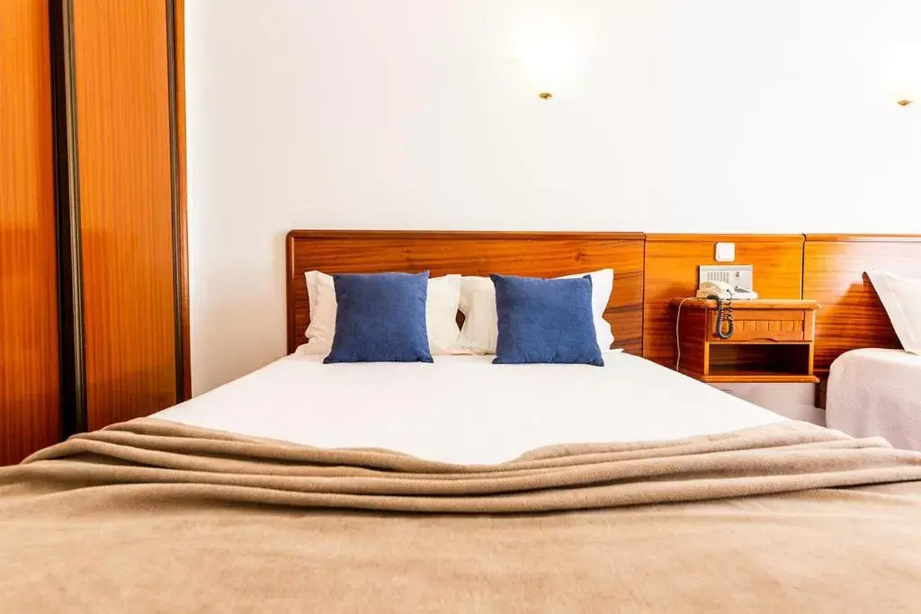 Bed in Dona Amélia Hotel by RIDAN Hotels