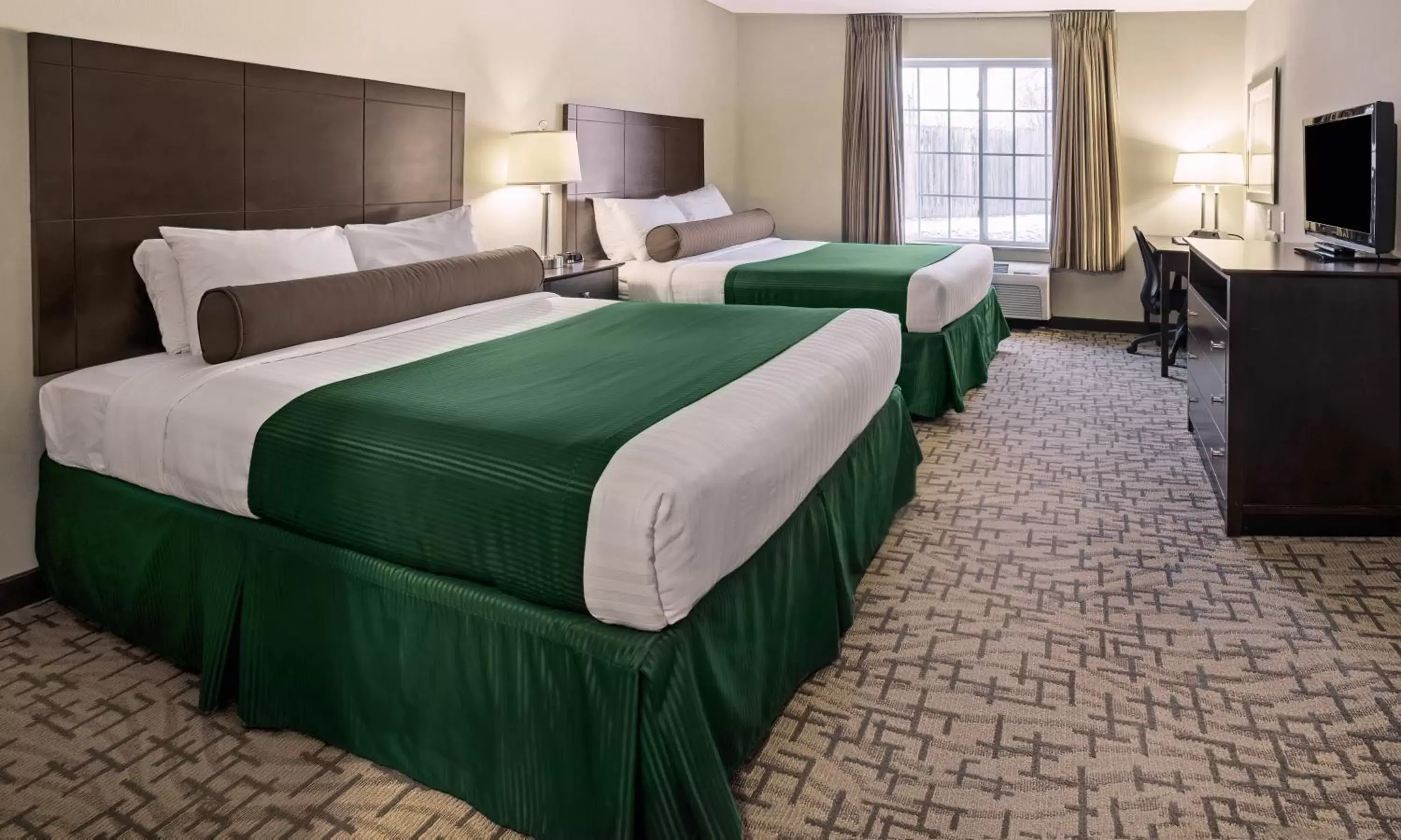 Bed in Cobblestone Inn & Suites - Durand