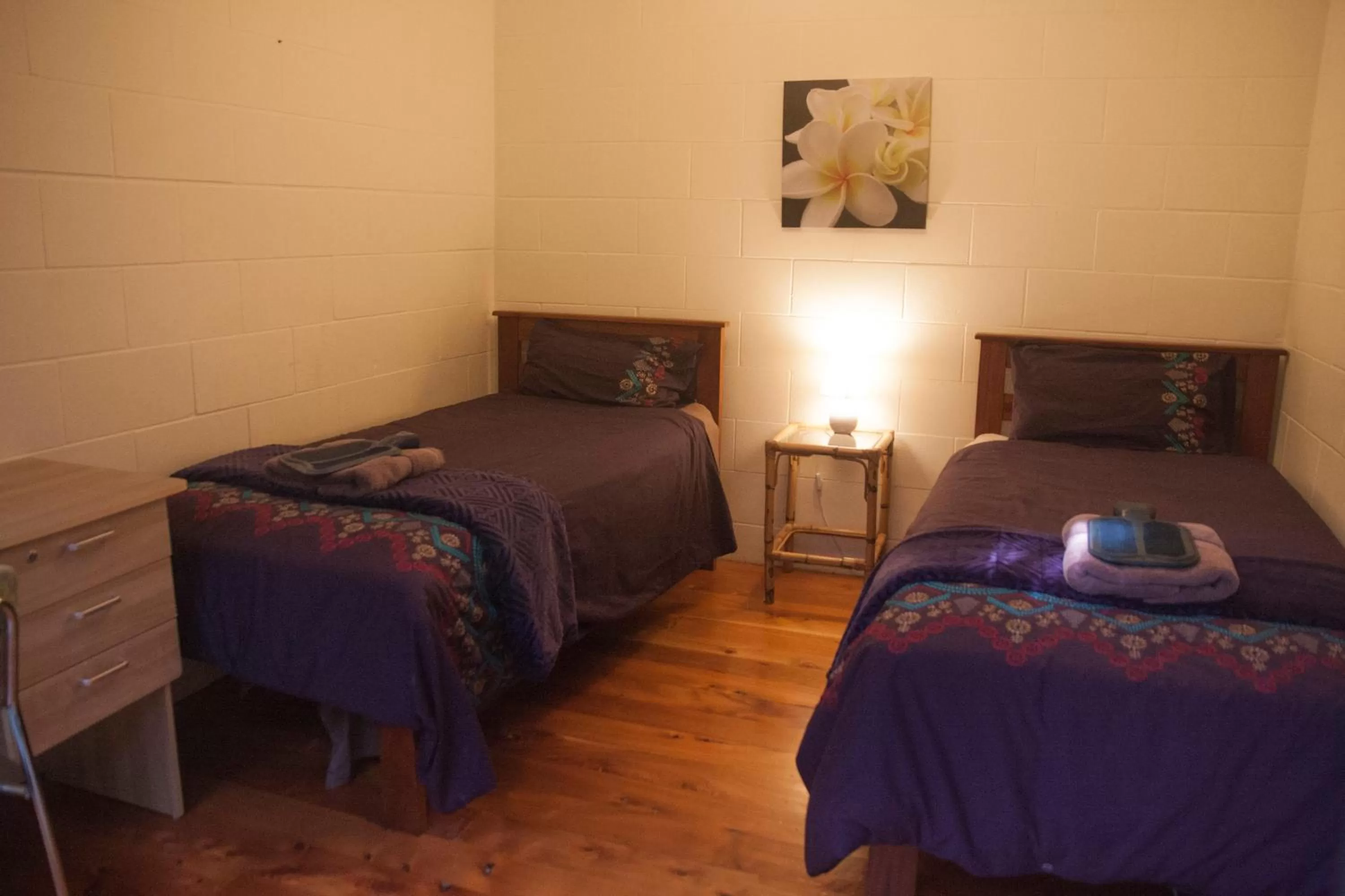 Bed in Kawai Purapura Yoga Retreat Centre