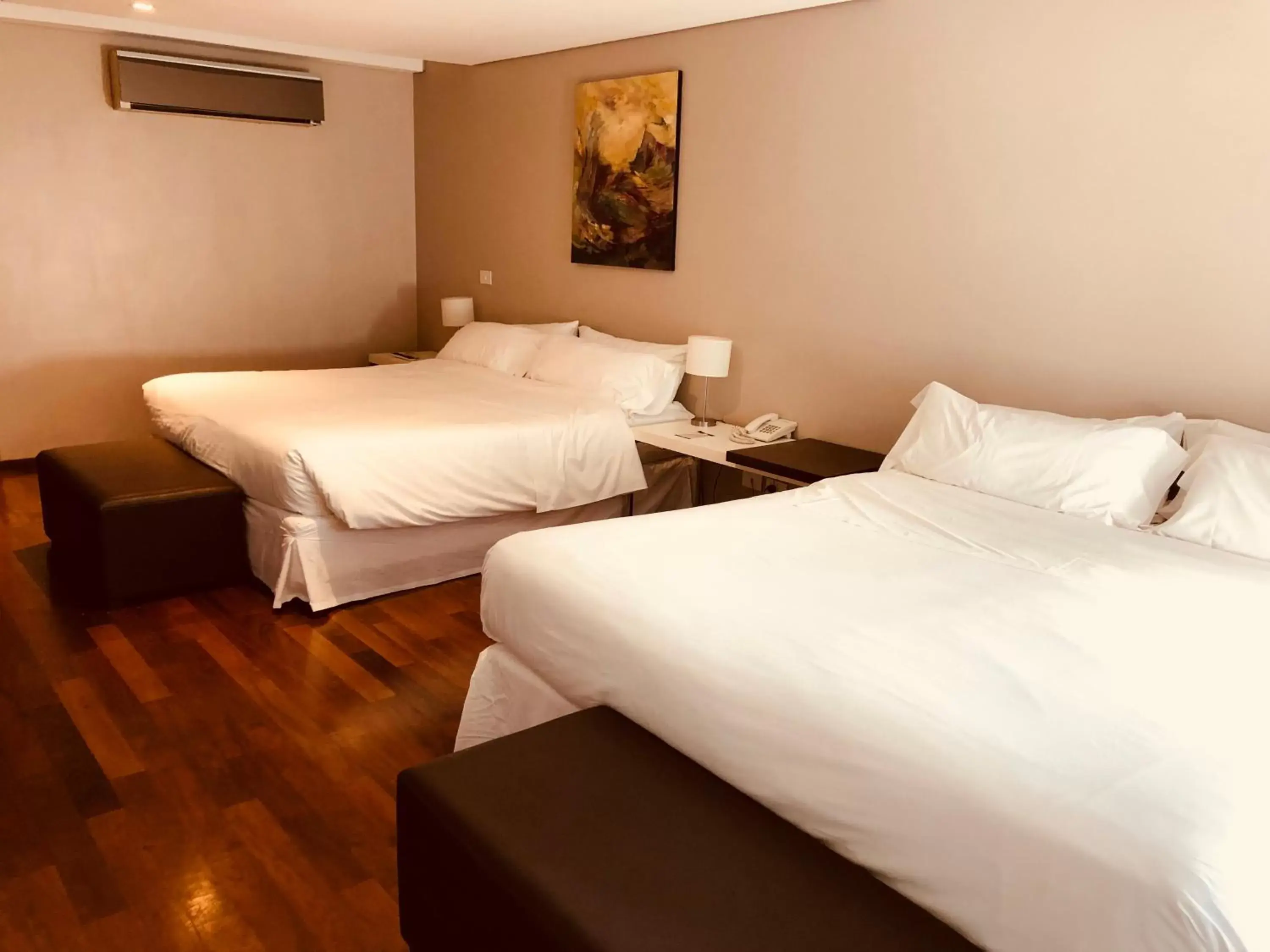 Bed in San Isidro Plaza Hotel