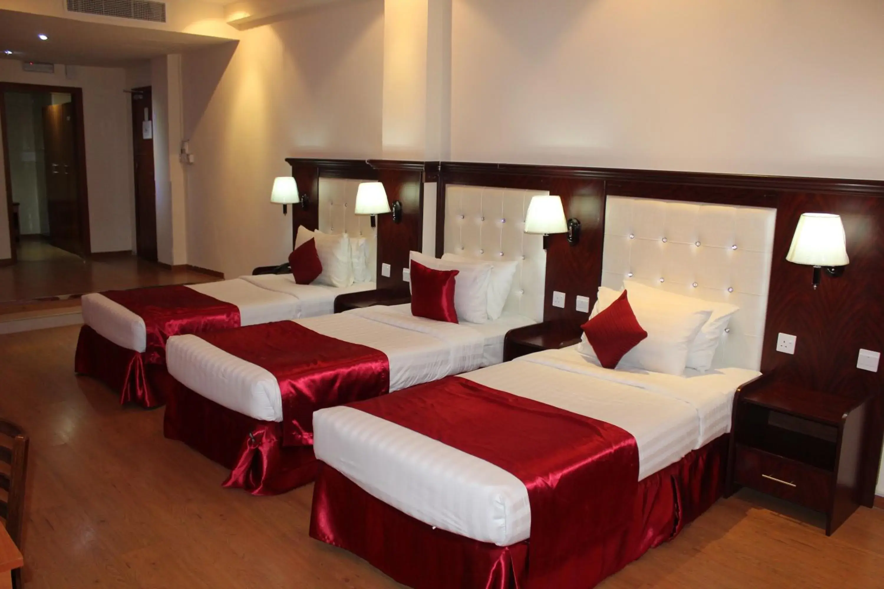 Bed in Grand Nova Hotel