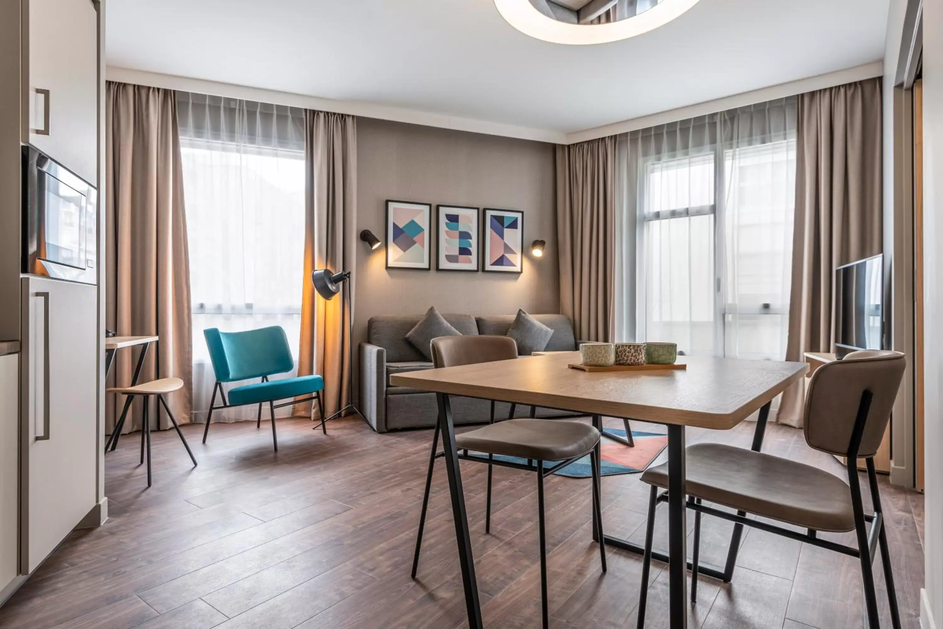Living room, Dining Area in Aparthotel Adagio Paris Nation