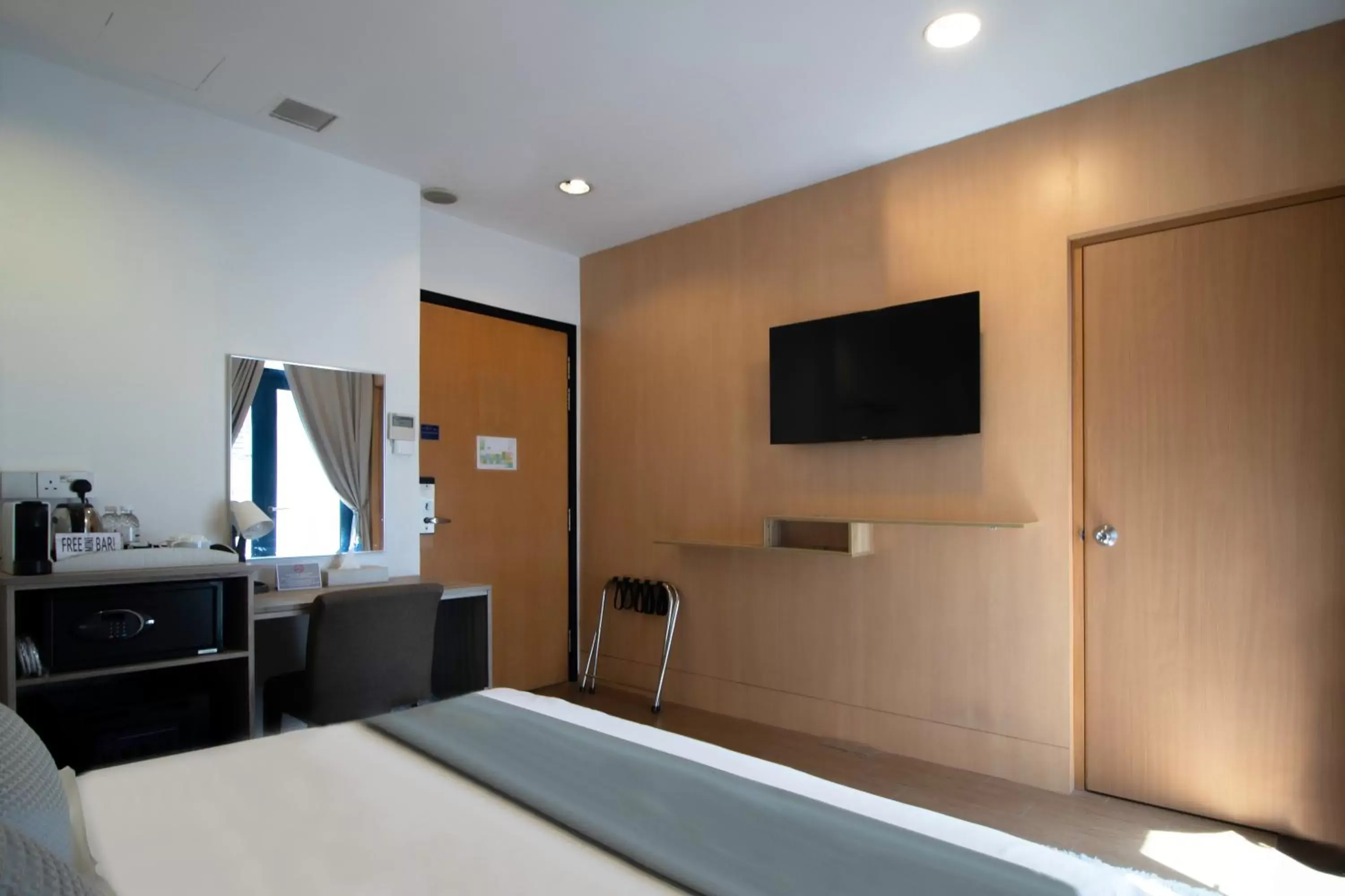 Bedroom, TV/Entertainment Center in Victoria Hotel a NuVe Group Collection