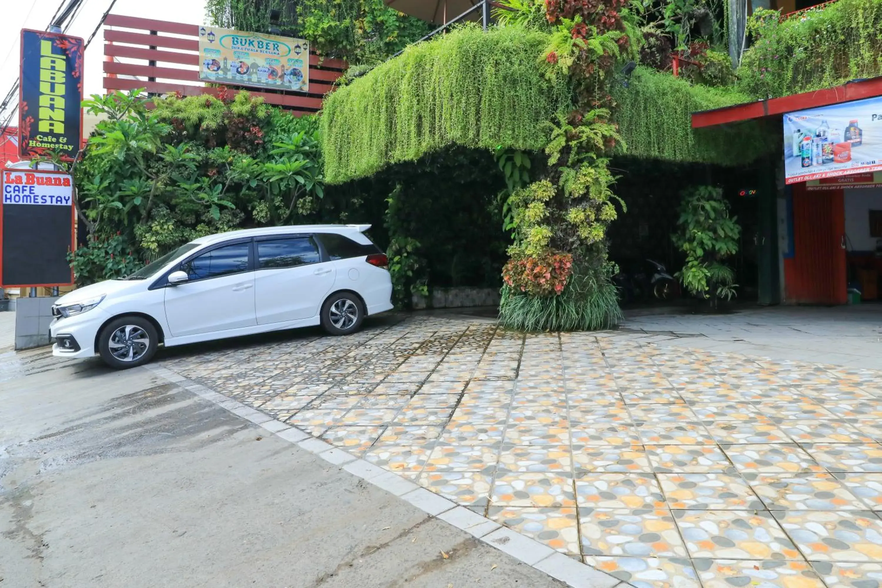 Facade/entrance in Labuana Homestay & Cafe Garden by ZUZU