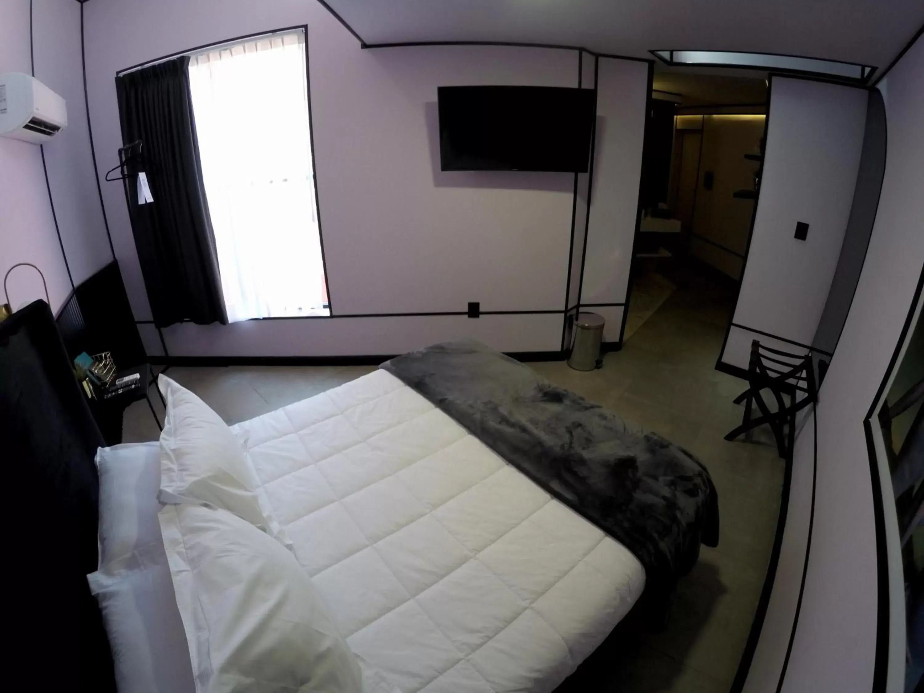 Communal lounge/ TV room, Bed in Casa Nada Hotel