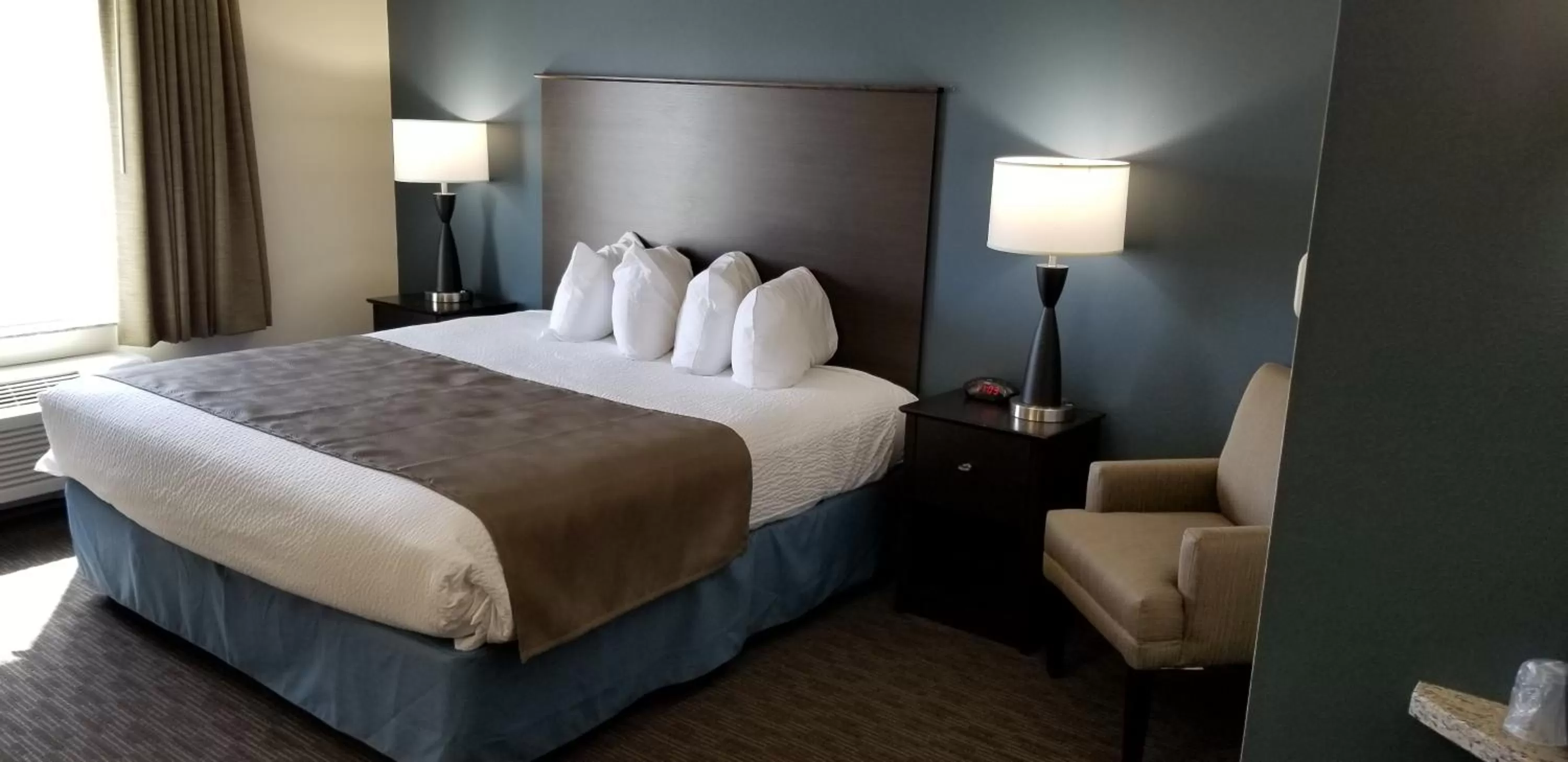 Bed in AmericInn by Wyndham Sioux Falls North