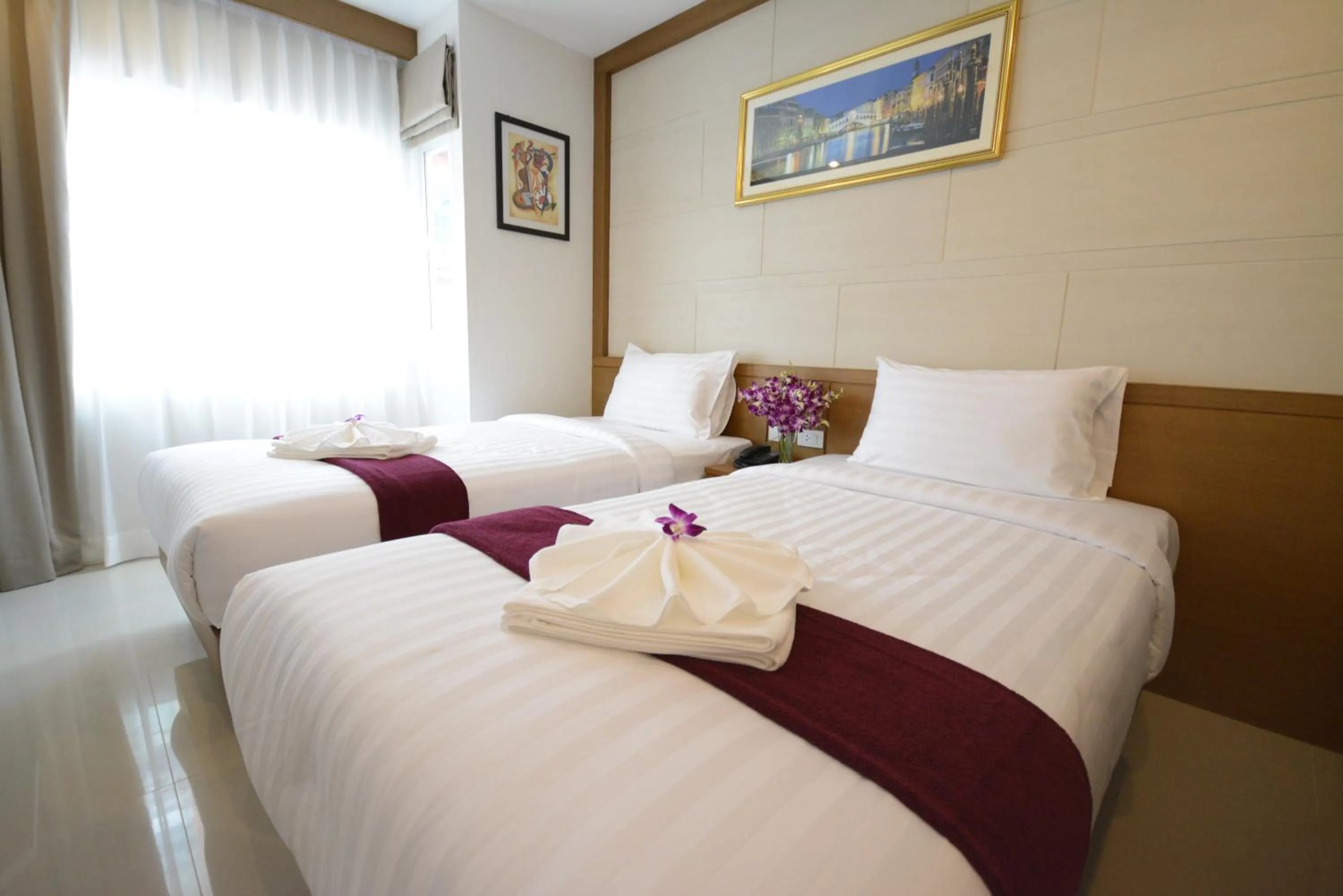 Bed in The Patong Center Hotel