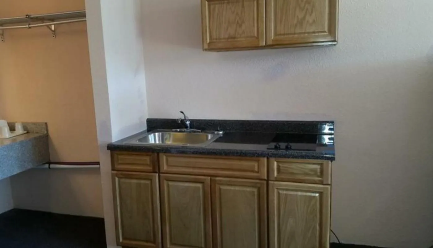 Kitchen or kitchenette in Americourt Extended Stays