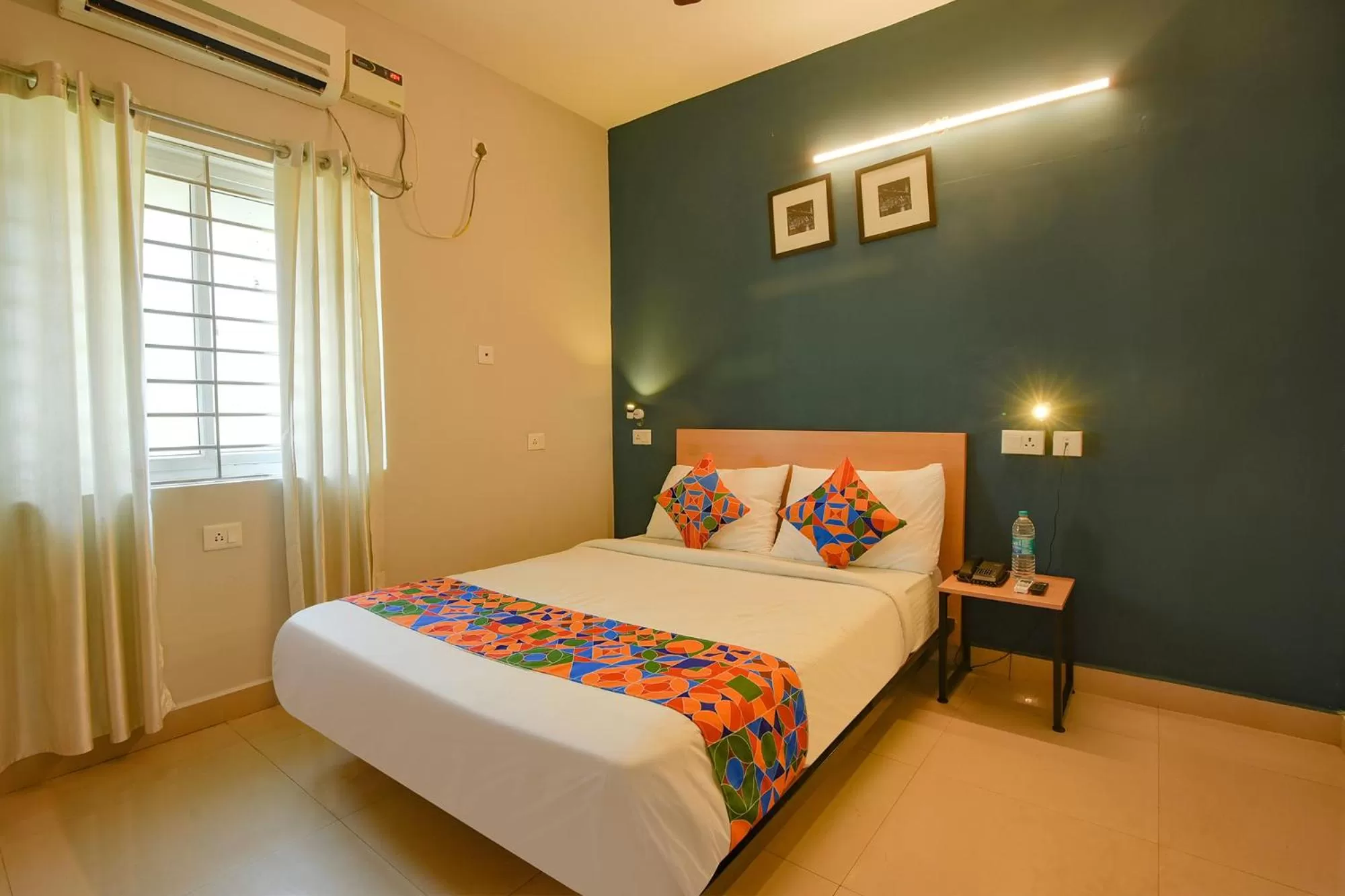 Bed in FabHotel Sasti Inn