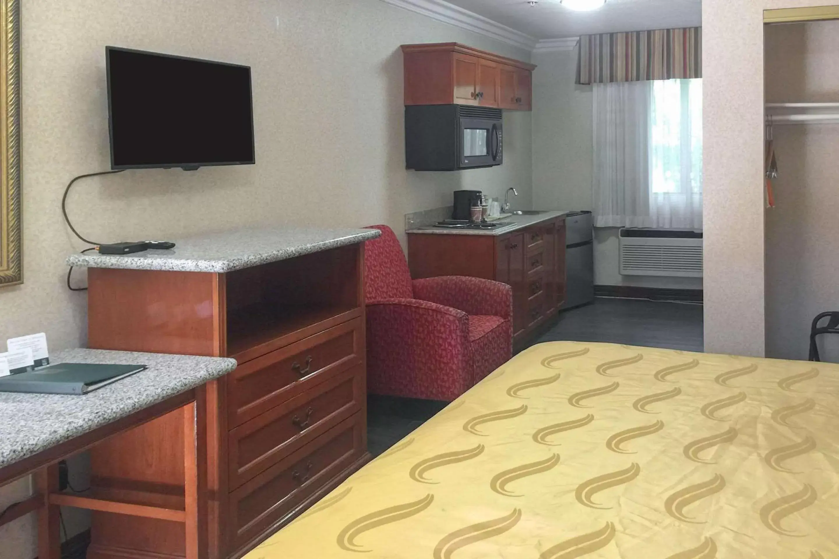 Photo of the whole room, TV/Entertainment Center in Quality Inn & Suites Oceanside Near Camp Pendleton