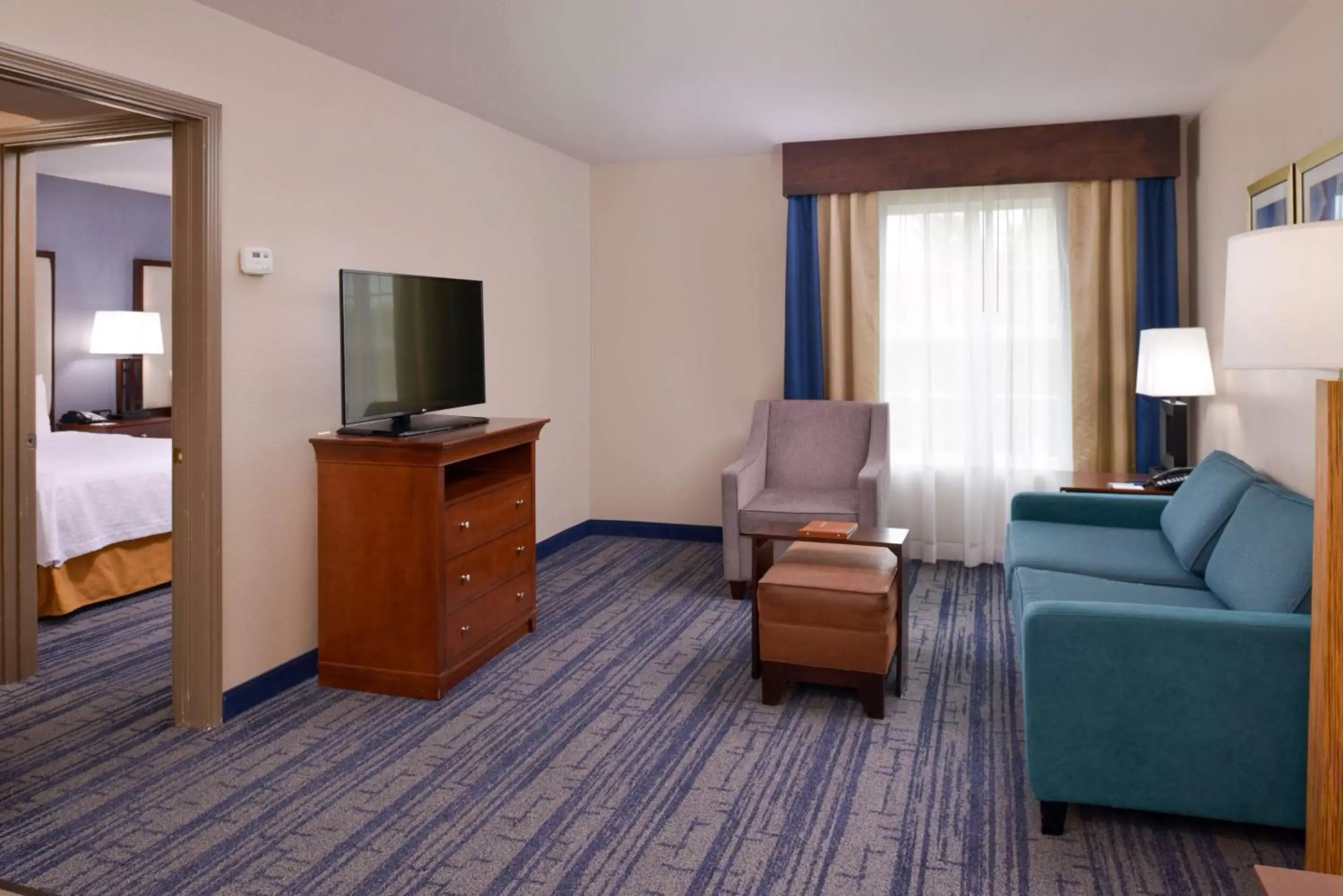 Living room, TV/Entertainment Center in Homewood Suites by Hilton Dallas-Lewisville