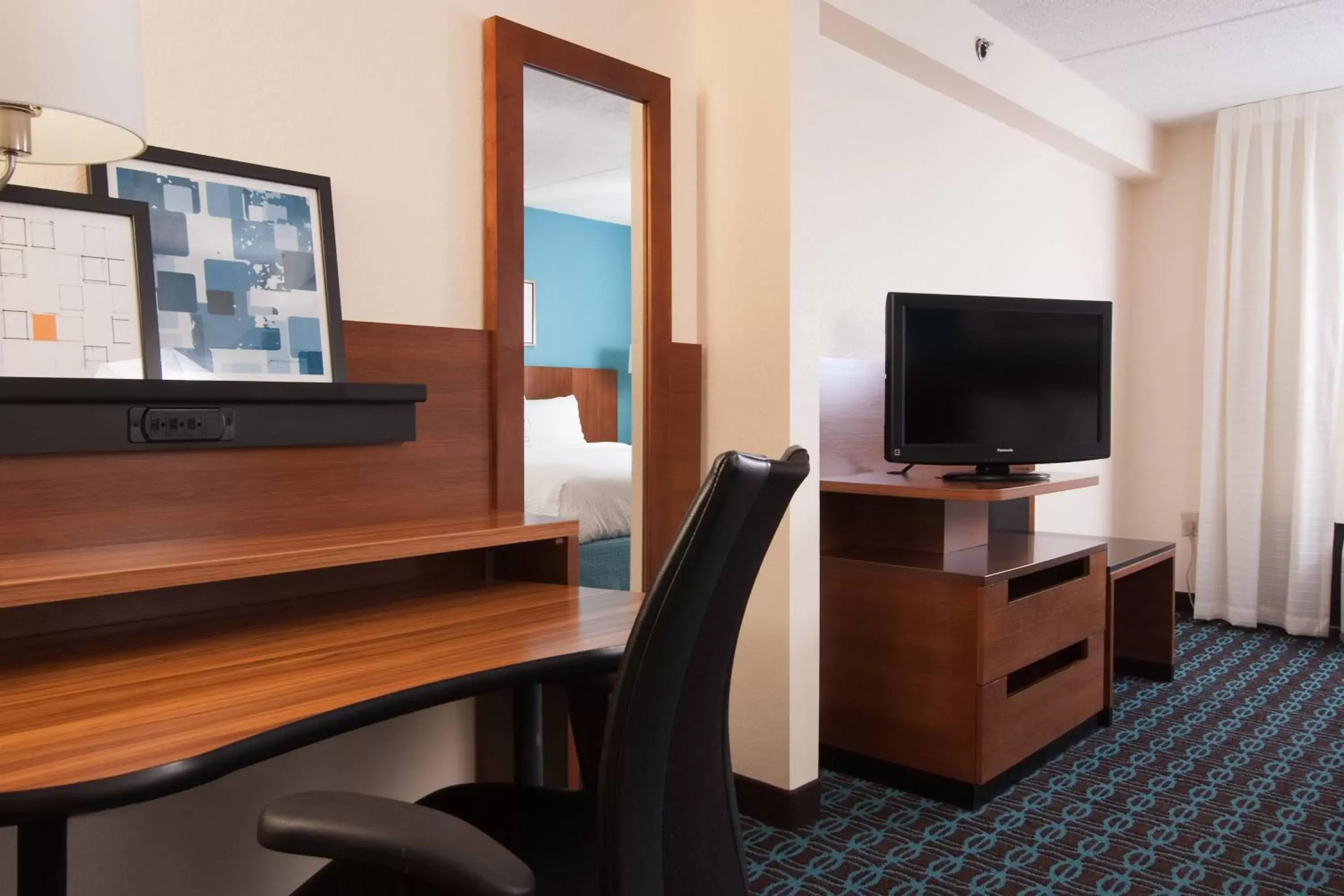 Photo of the whole room, TV/Entertainment Center in Fairfield Inn and Suites Atlanta Airport South/Sullivan Road