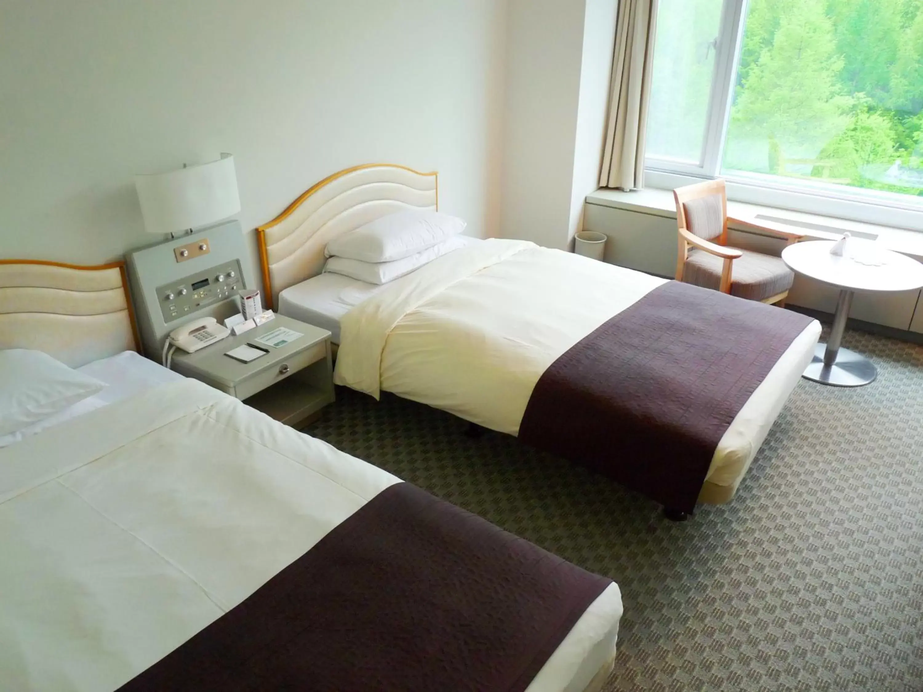 Bed in Shin Furano Prince Hotel