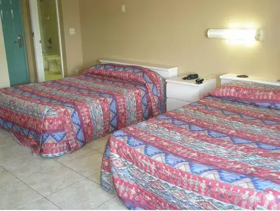 Bed in Miami Princess Hotel