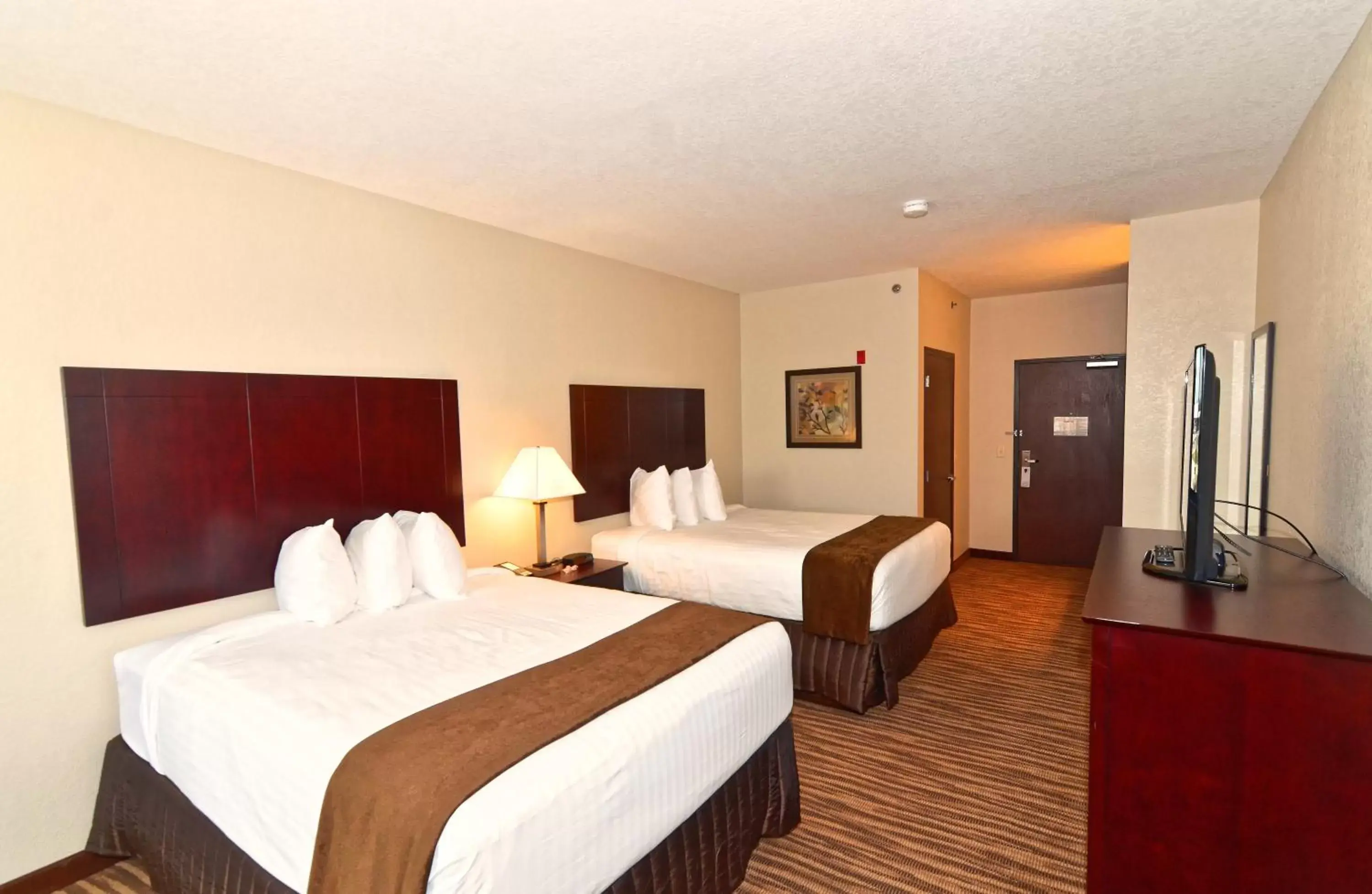 Bed in Cobblestone Inn & Suites - Clarion