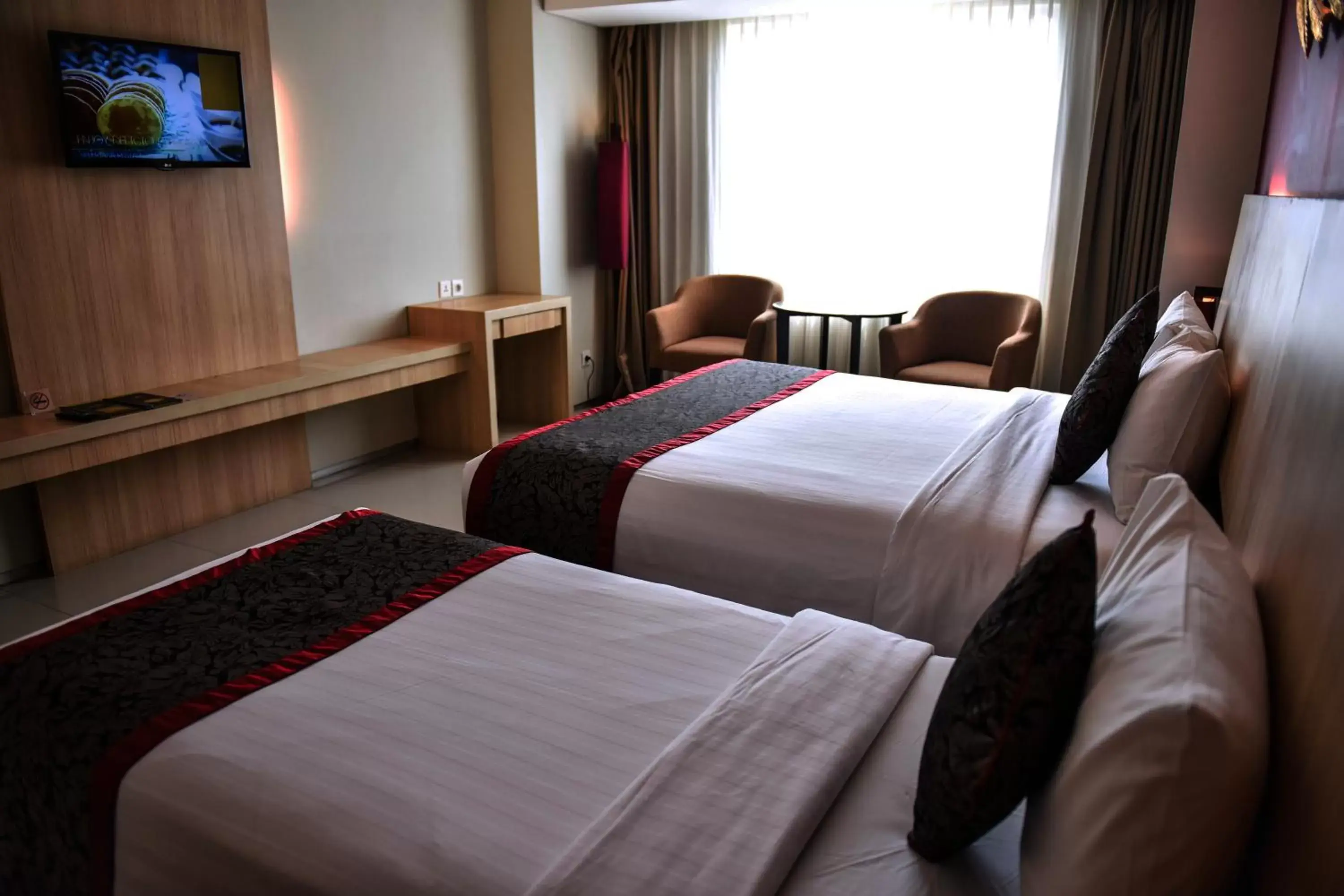 Bed in The Kana Kuta Hotel