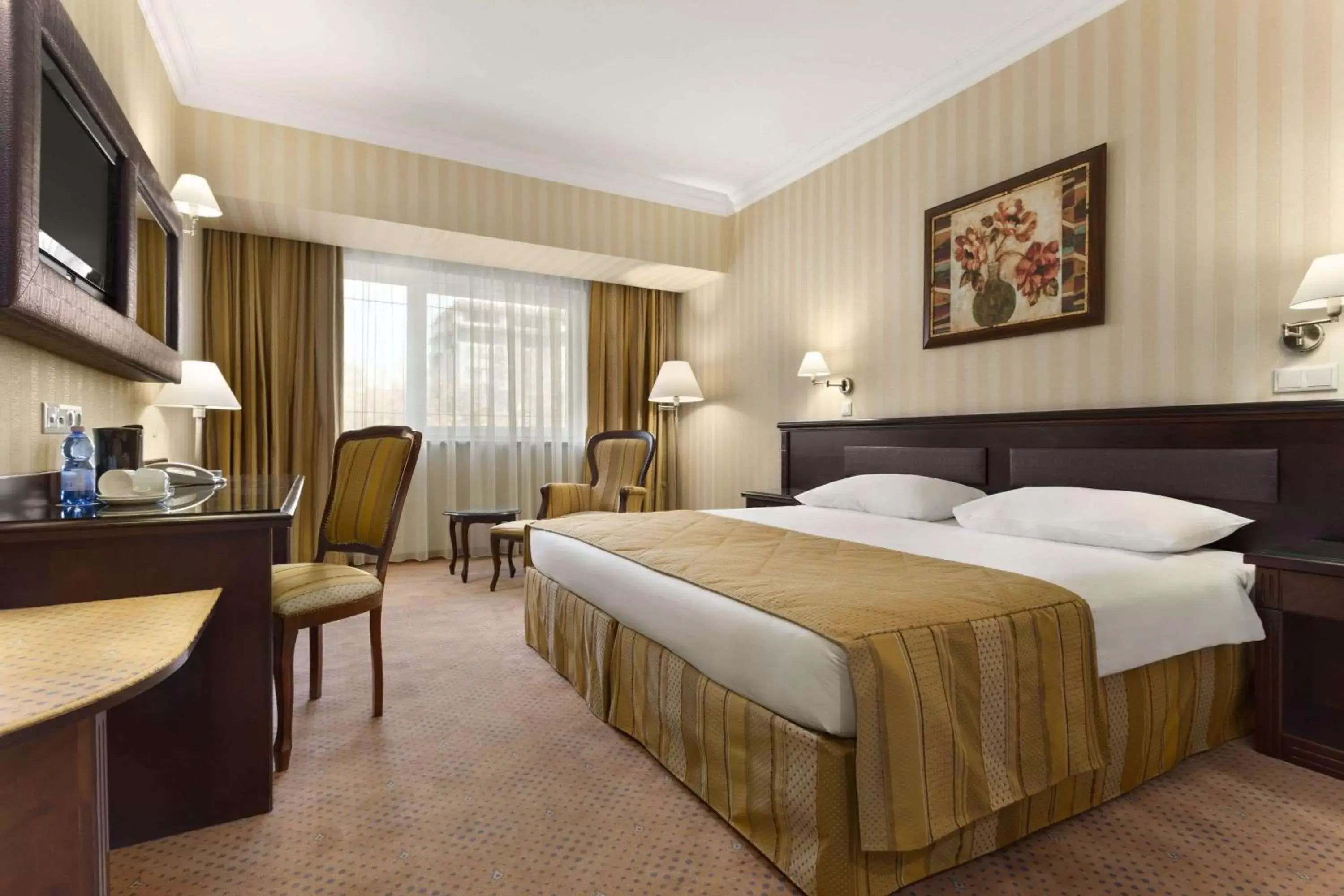 Photo of the whole room, Bed in Ramada Hotel & Suites by Wyndham Bucharest North