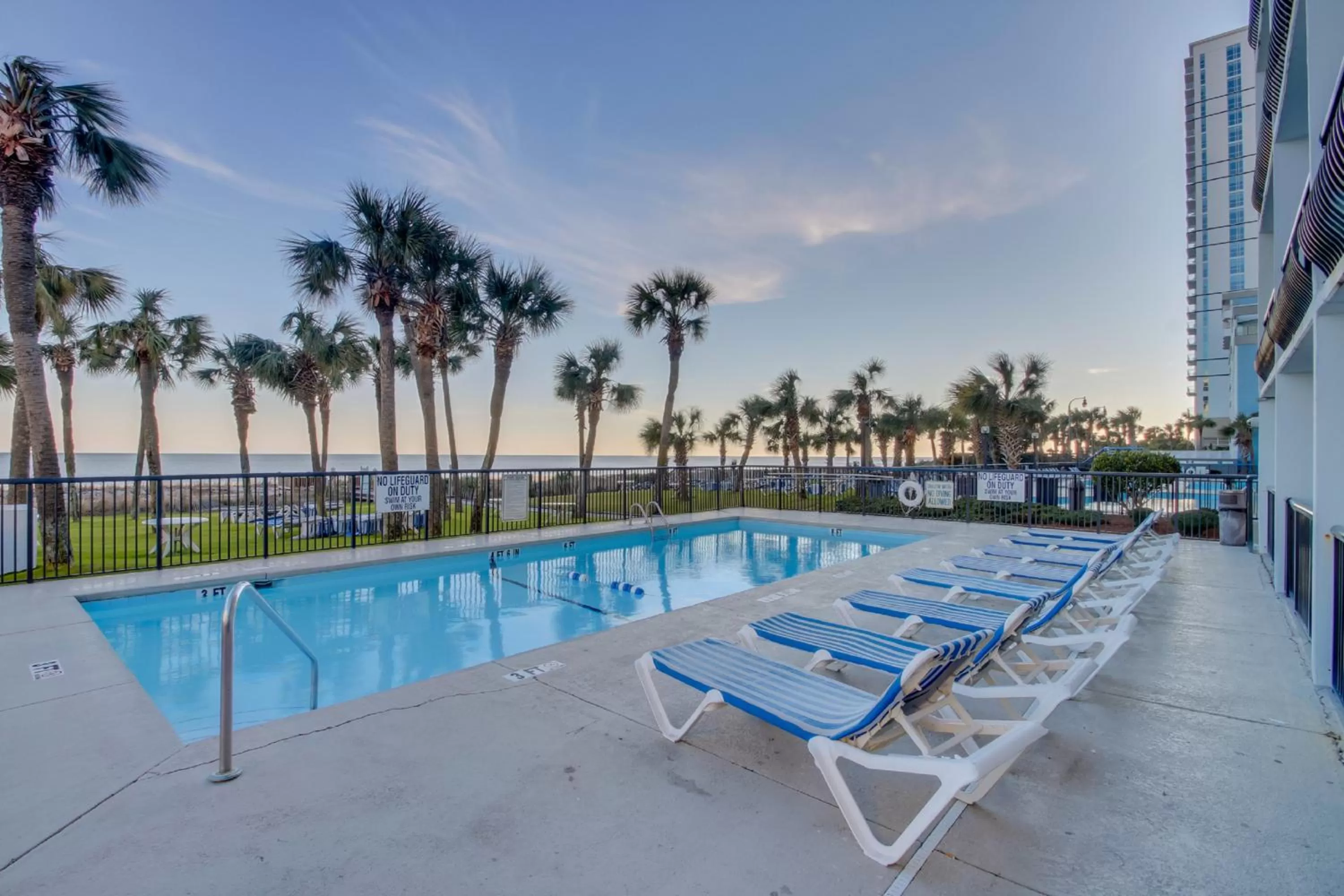 Swimming pool in Boardwalk Beach Resort Condo w Oceanfront Balcony