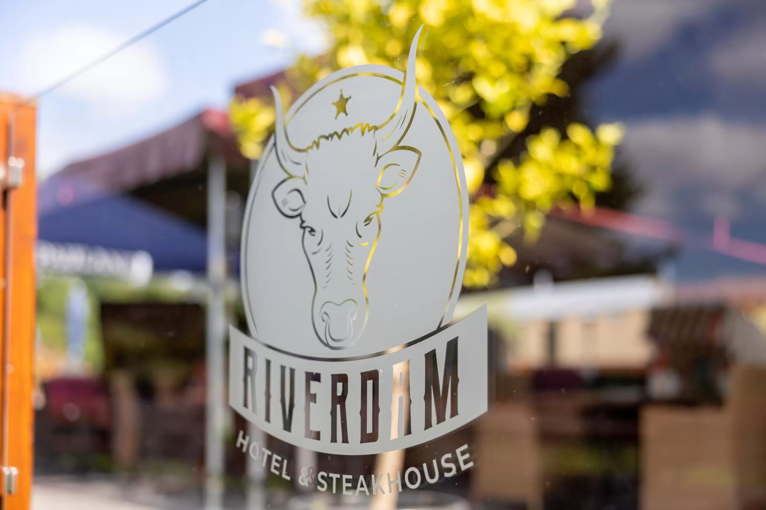 Property logo or sign in Riverdam Boutique Hotel