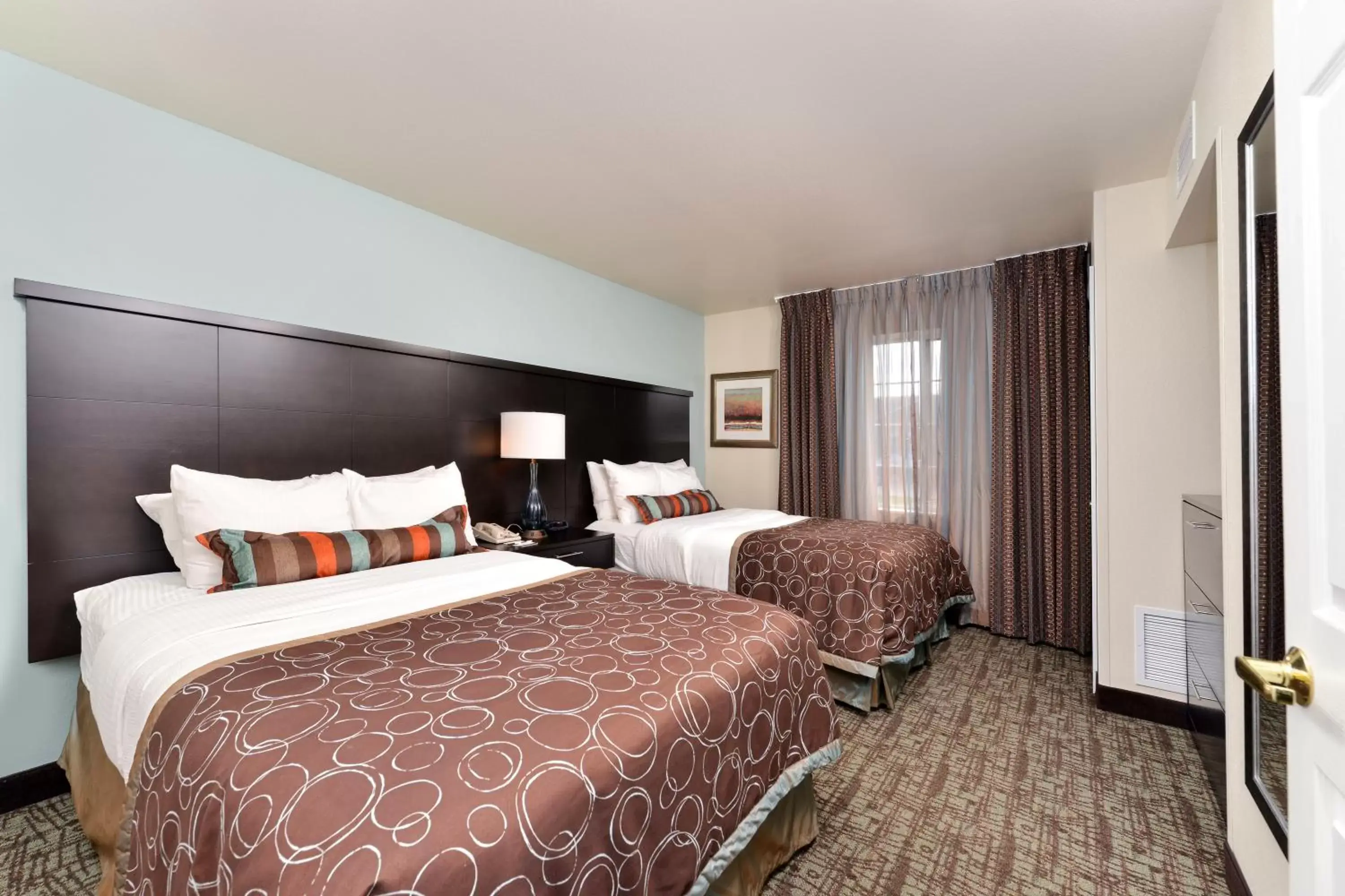 Bed in Staybridge Suites Sioux Falls at Empire Mall, an IHG Hotel