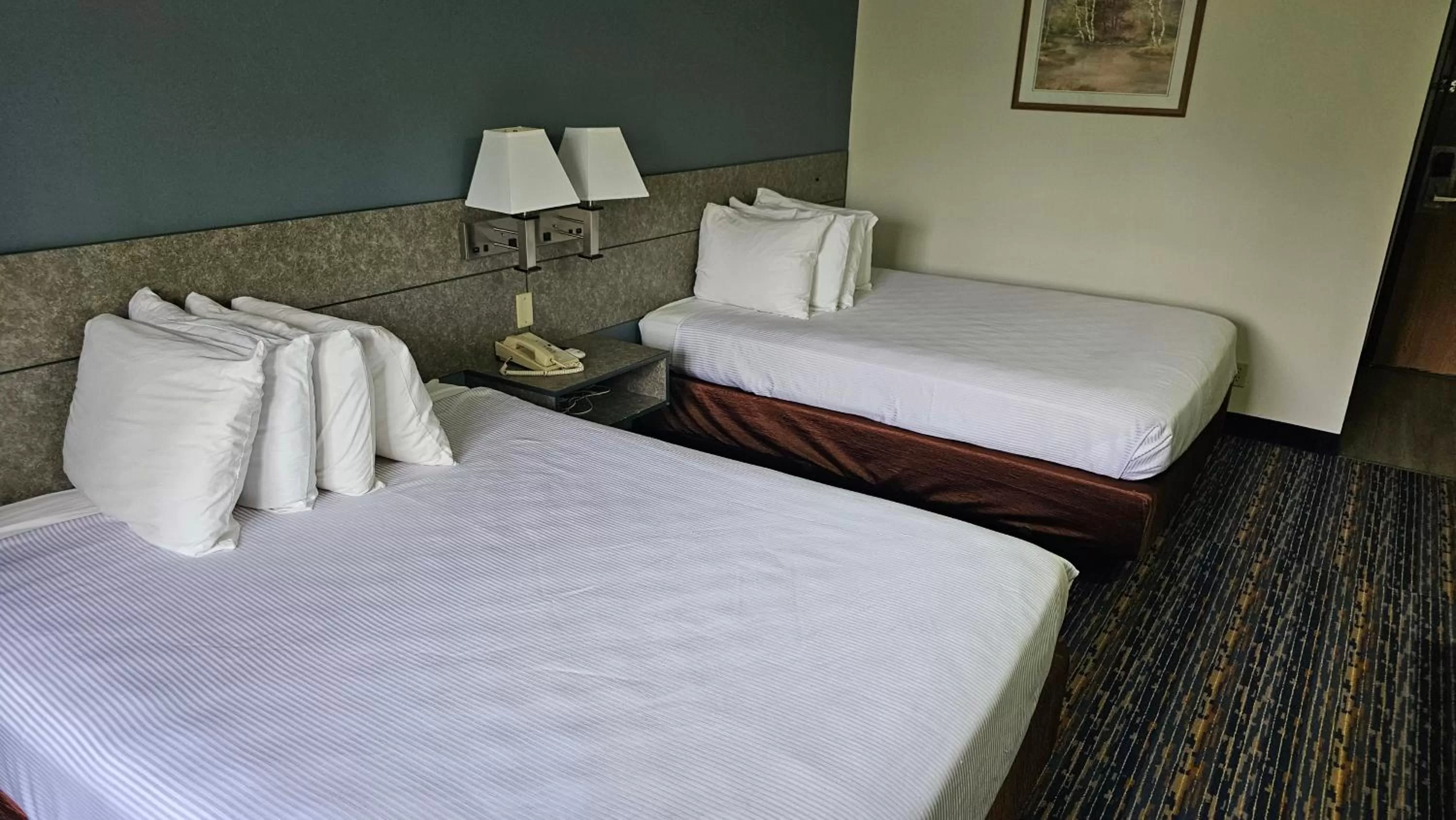 Photo of the whole room, Bed in MJ INN and SUITES