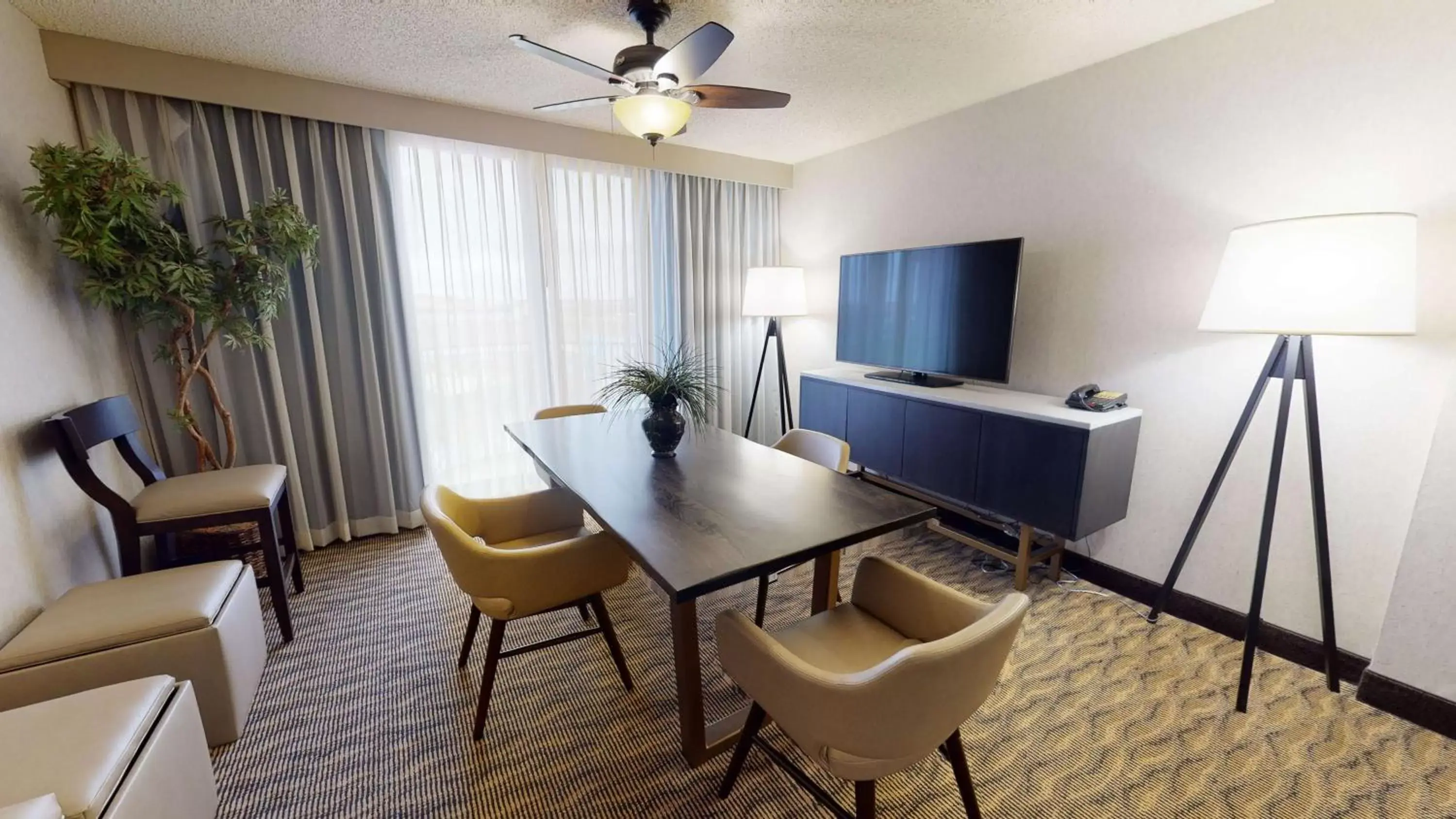 Living room, TV/Entertainment Center in Embassy Suites by Hilton Oklahoma City Will Rogers Airport