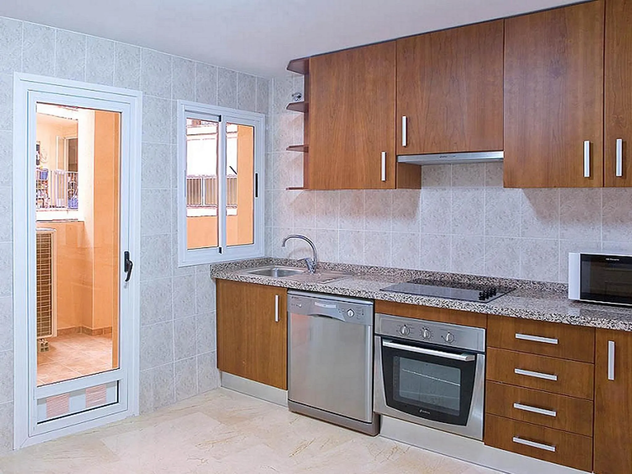 Kitchen or kitchenette in Apartamentos Magic Atrium Plaza