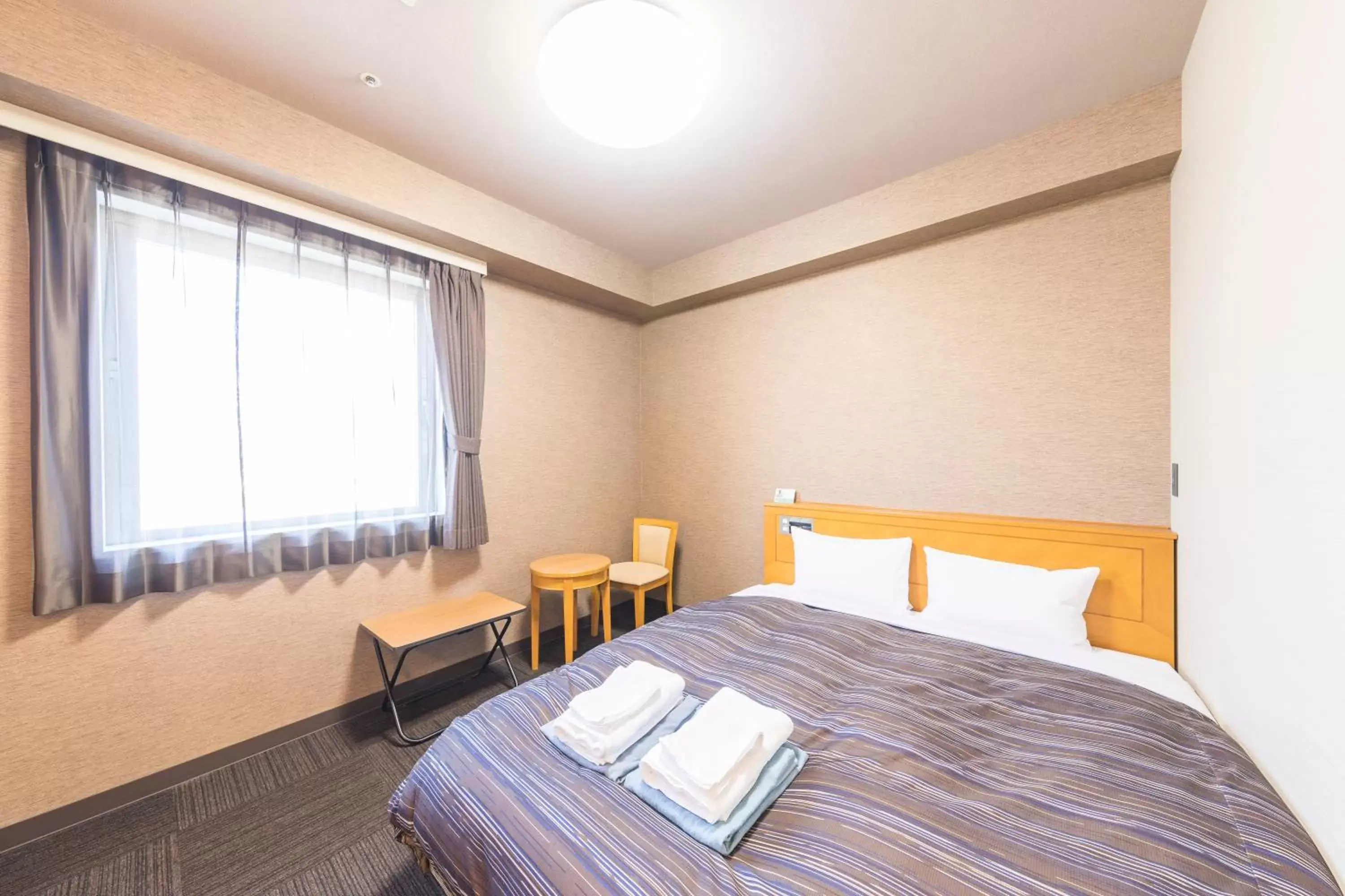 Bed in Route Inn Grantia Hanyu Spa Resort