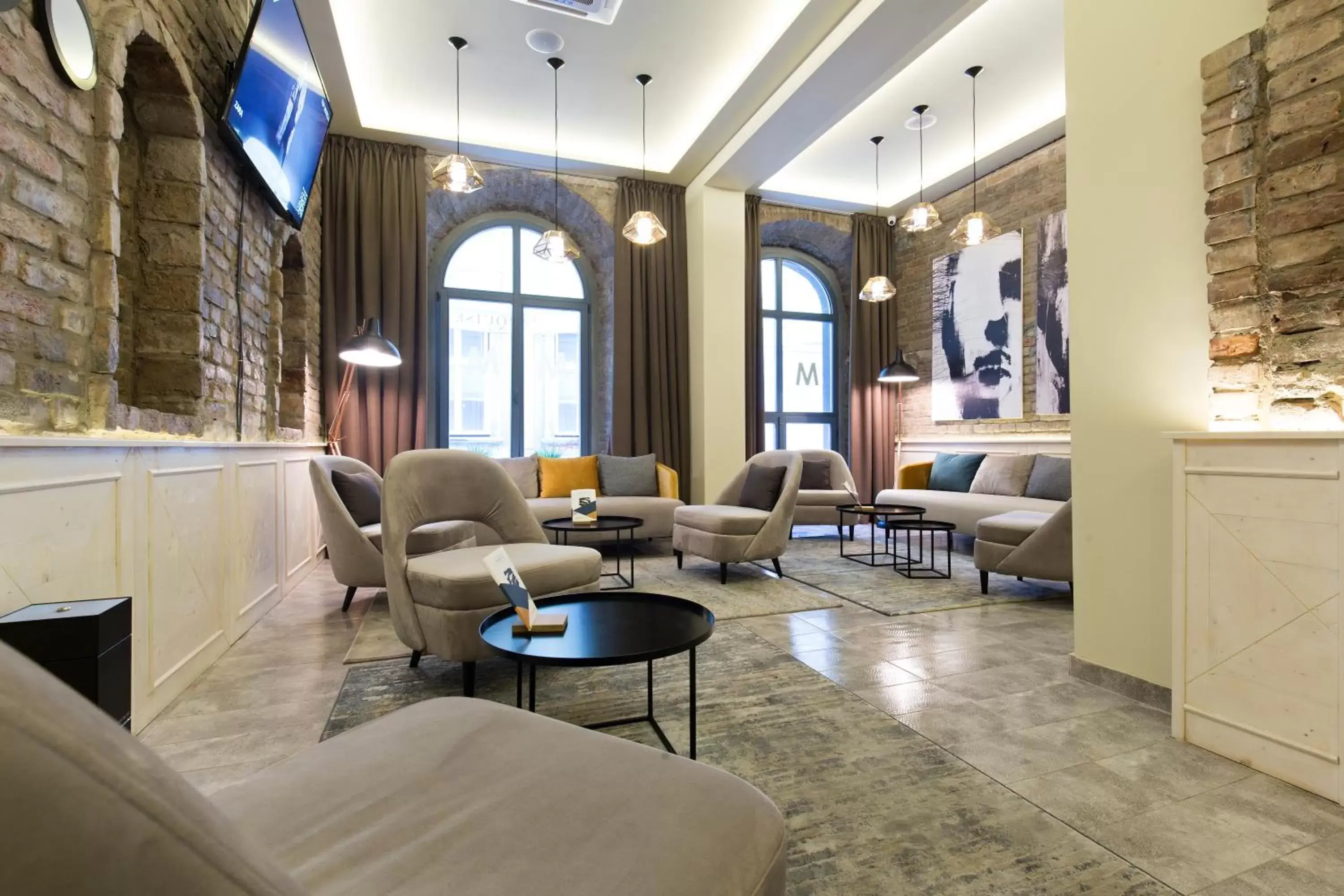 Communal lounge/ TV room, Seating Area in Marquise Hotel Garni