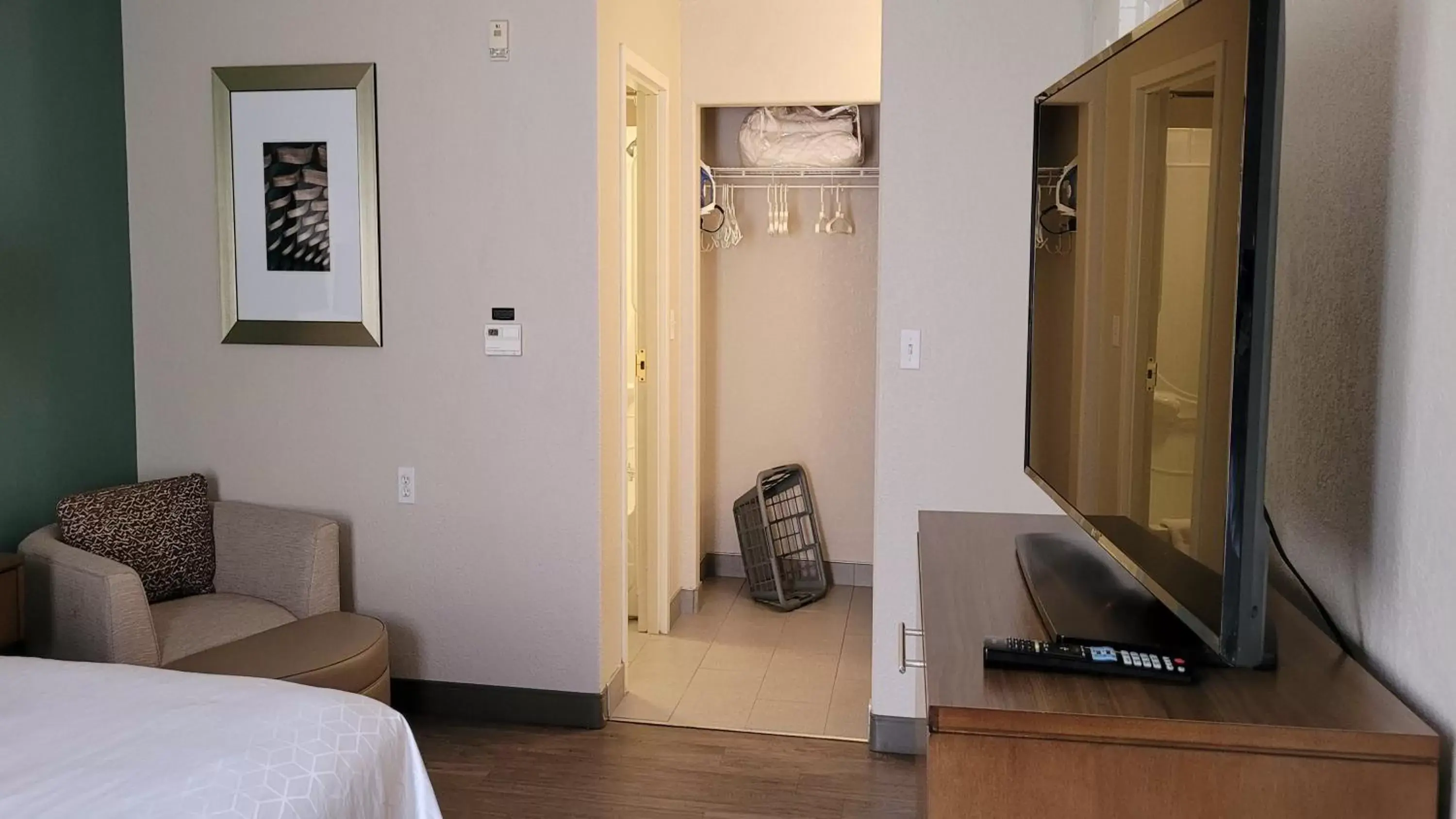 Bedroom, Seating Area in Staybridge Suites - Calgary Airport, an IHG Hotel