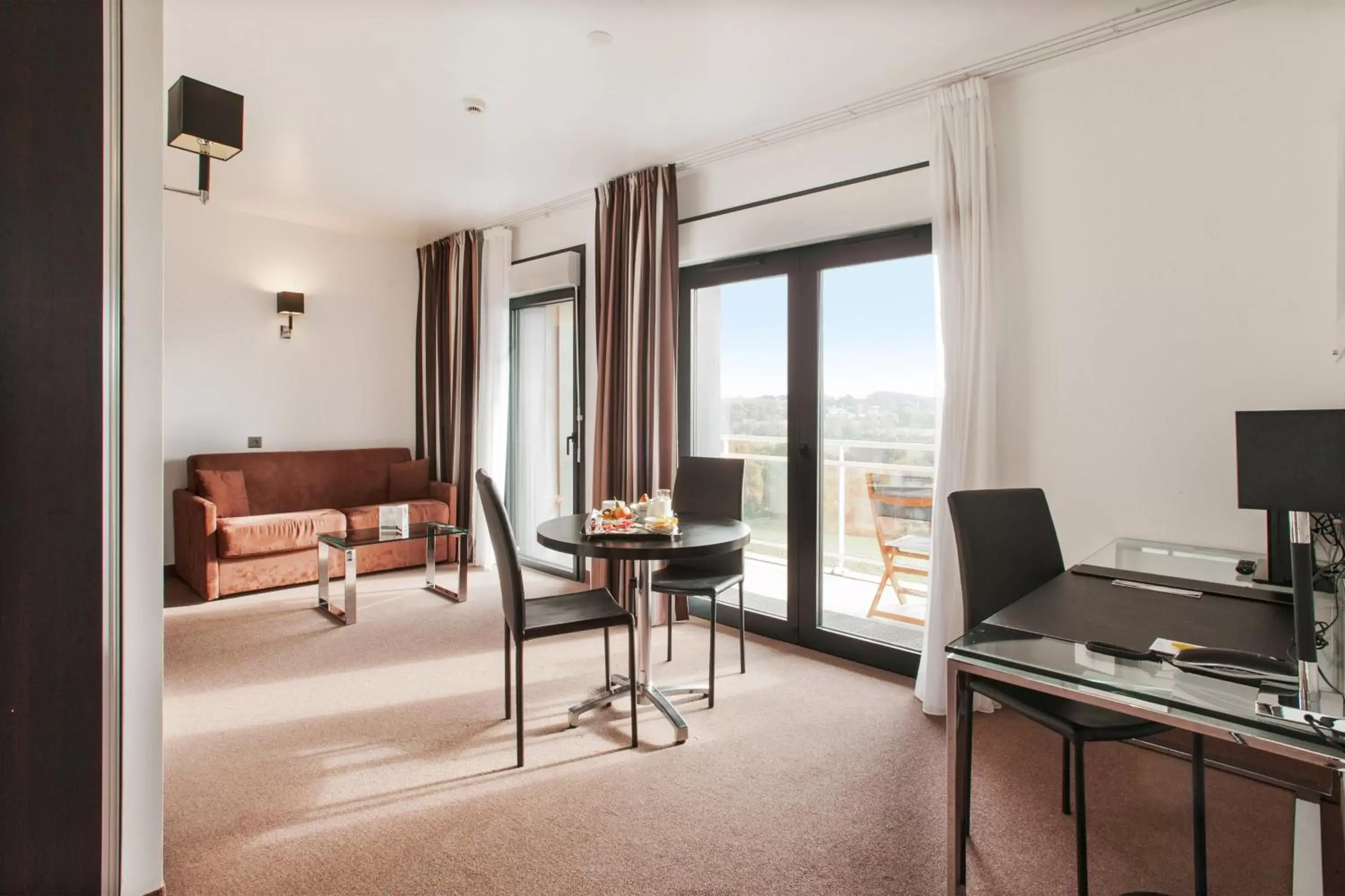 Seating area, TV/Entertainment Center in Golden Tulip Pornic Suites