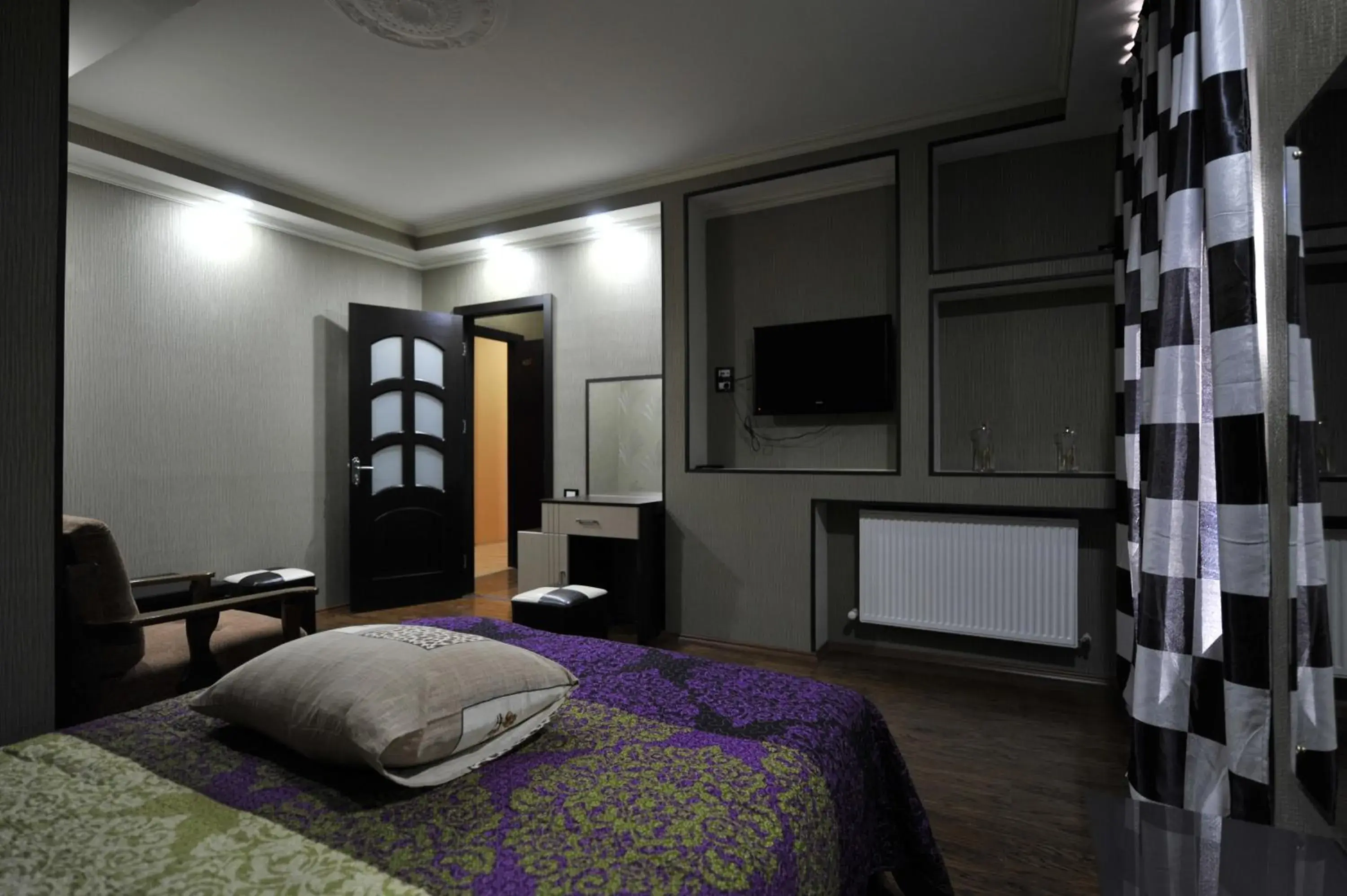 Bedroom, TV/Entertainment Center in Dkd-bridge Hotel