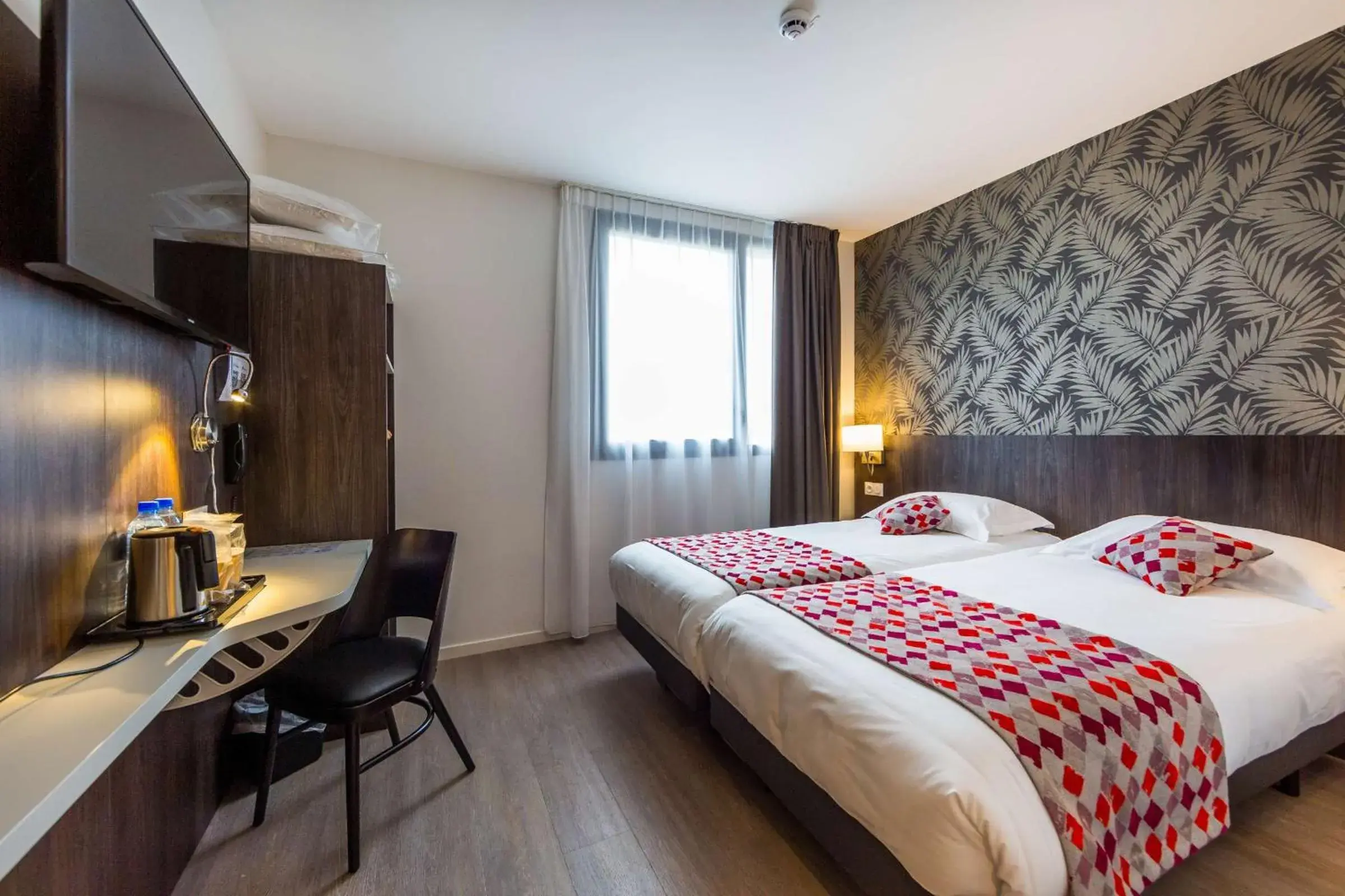 Bedroom in Brit Hotel Ploermel - Hotel de l'Hippodrome