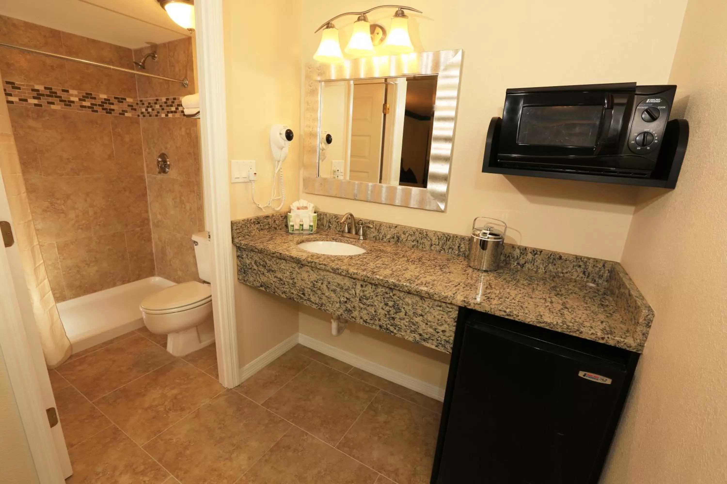 Bathroom in SureStay Plus by Best Western Orlando International Drive