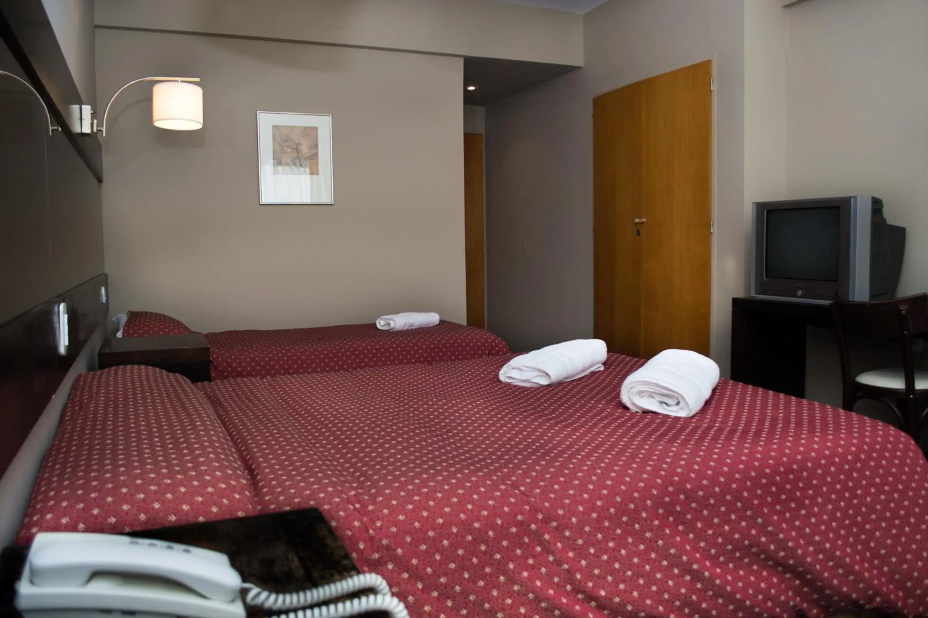 Bed in Marcopolo Suites Calafate