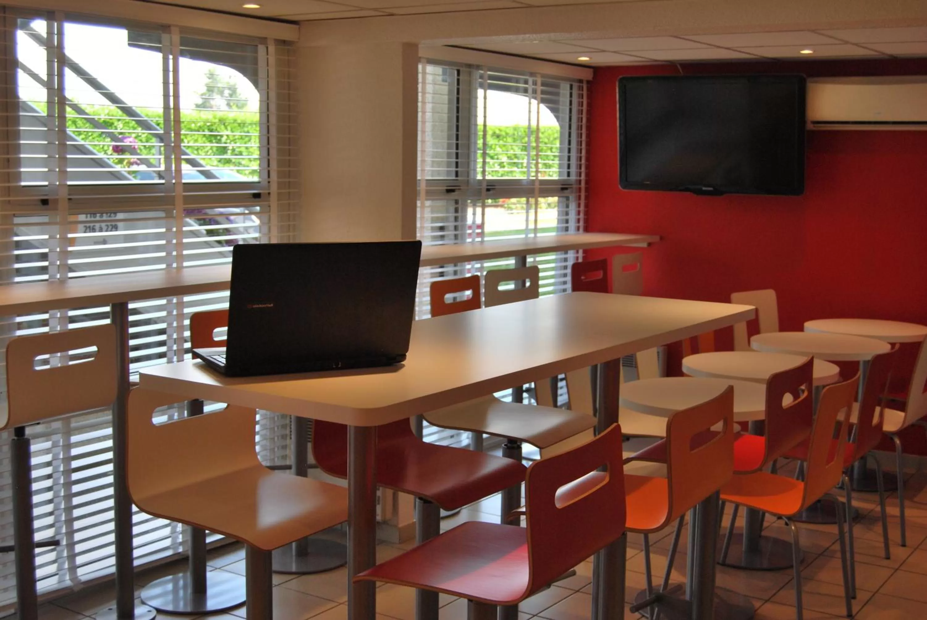 Communal lounge/ TV room in Premiere Classe Vannes