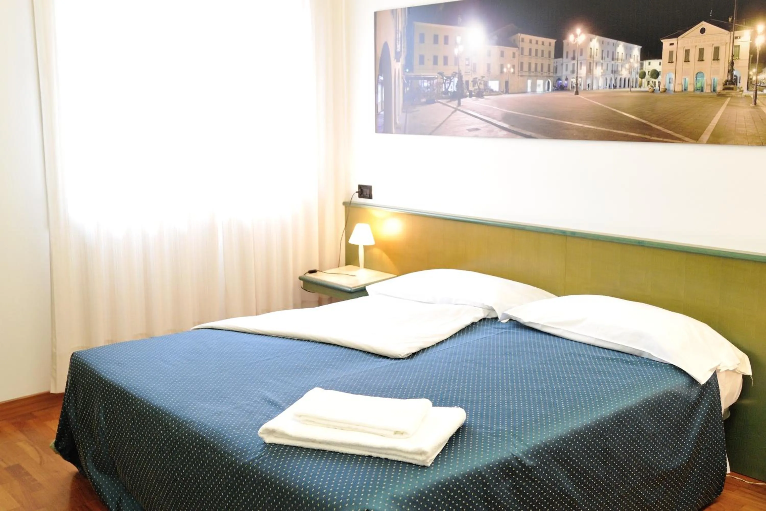 Bed in Rometta Hotel