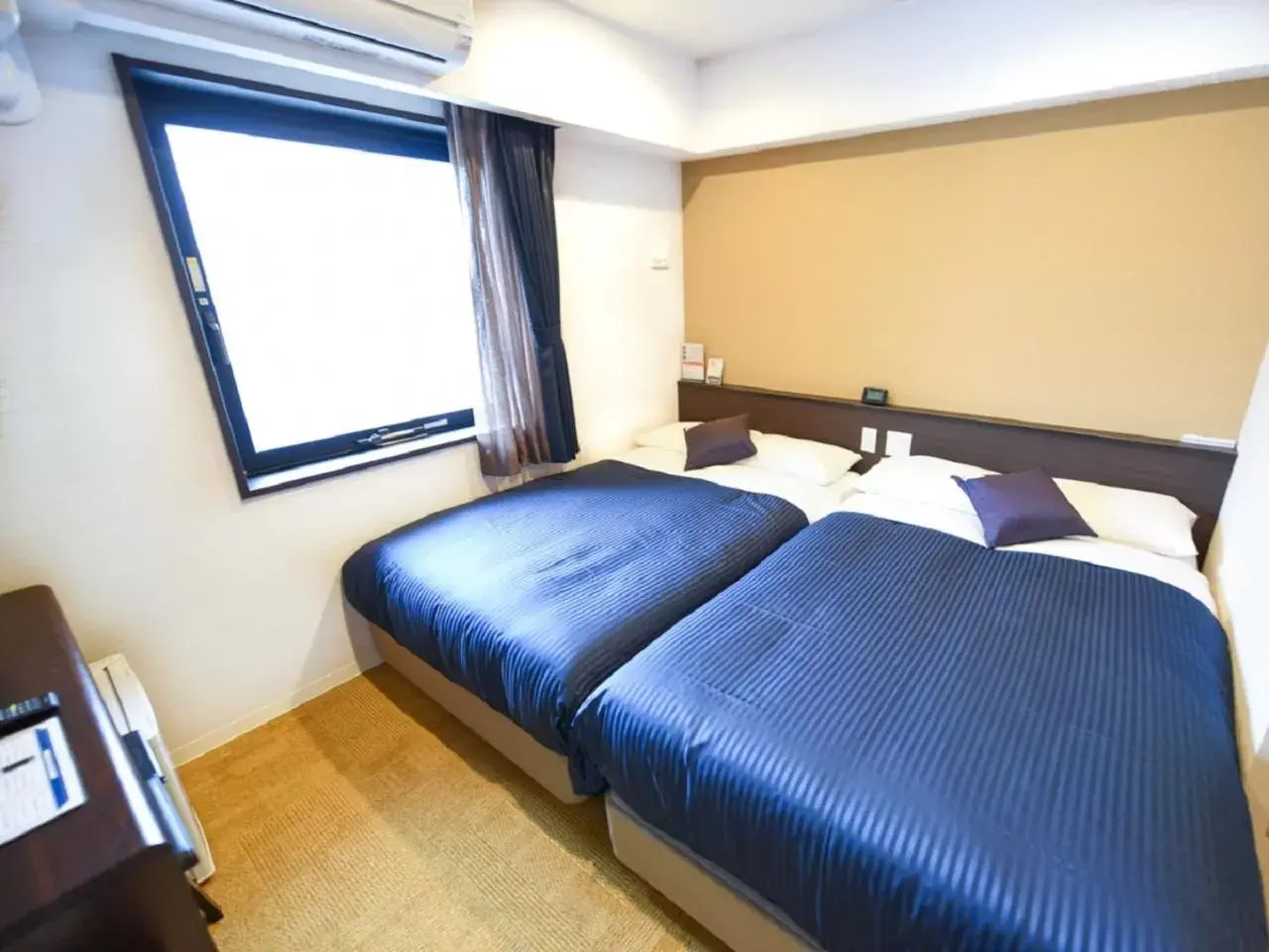 Bed in HOTEL LiVEMAX Fukuoka Tenjin