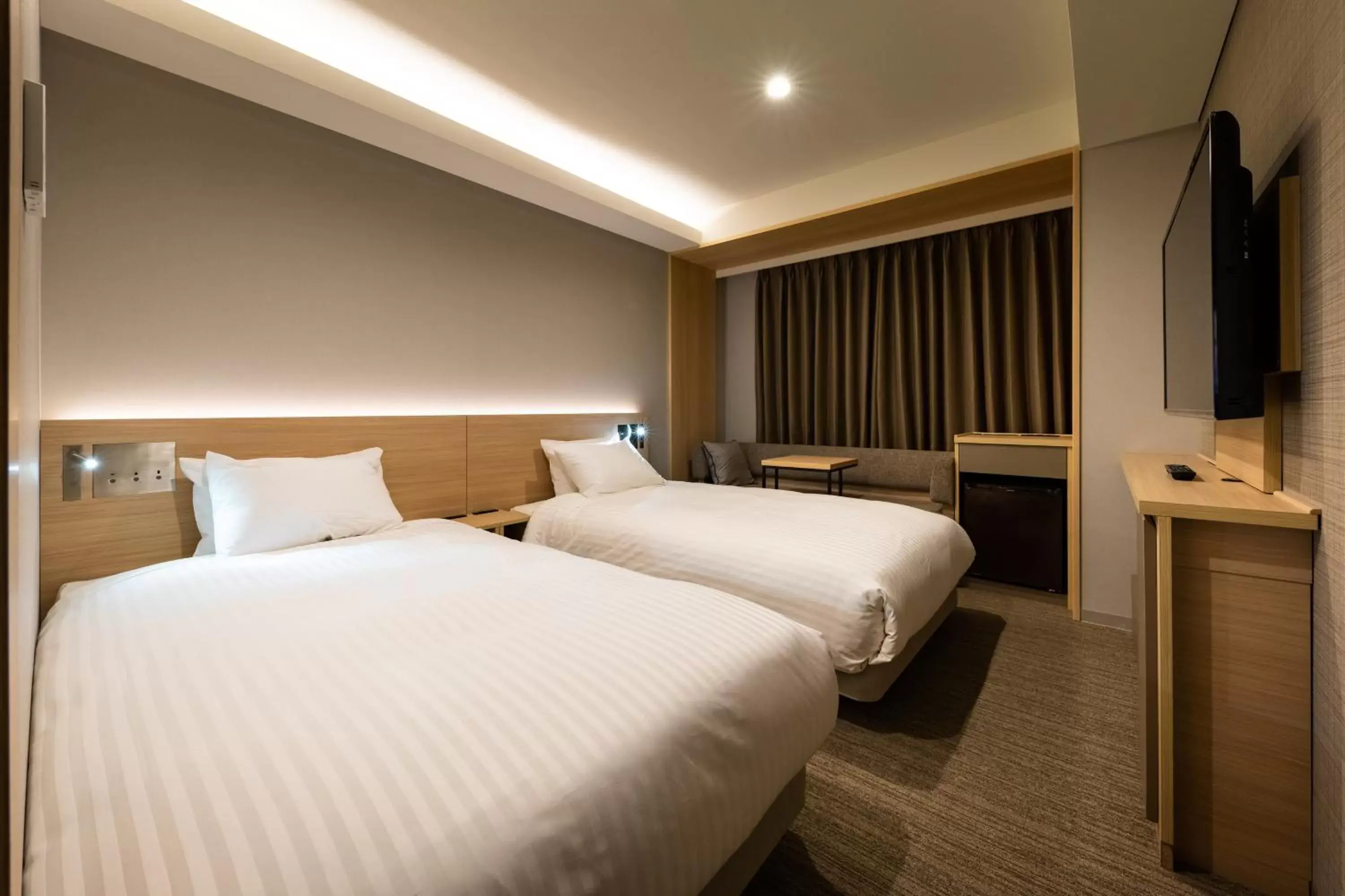 Photo of the whole room, Bed in Nishitetsu Hotel Croom Nagoya